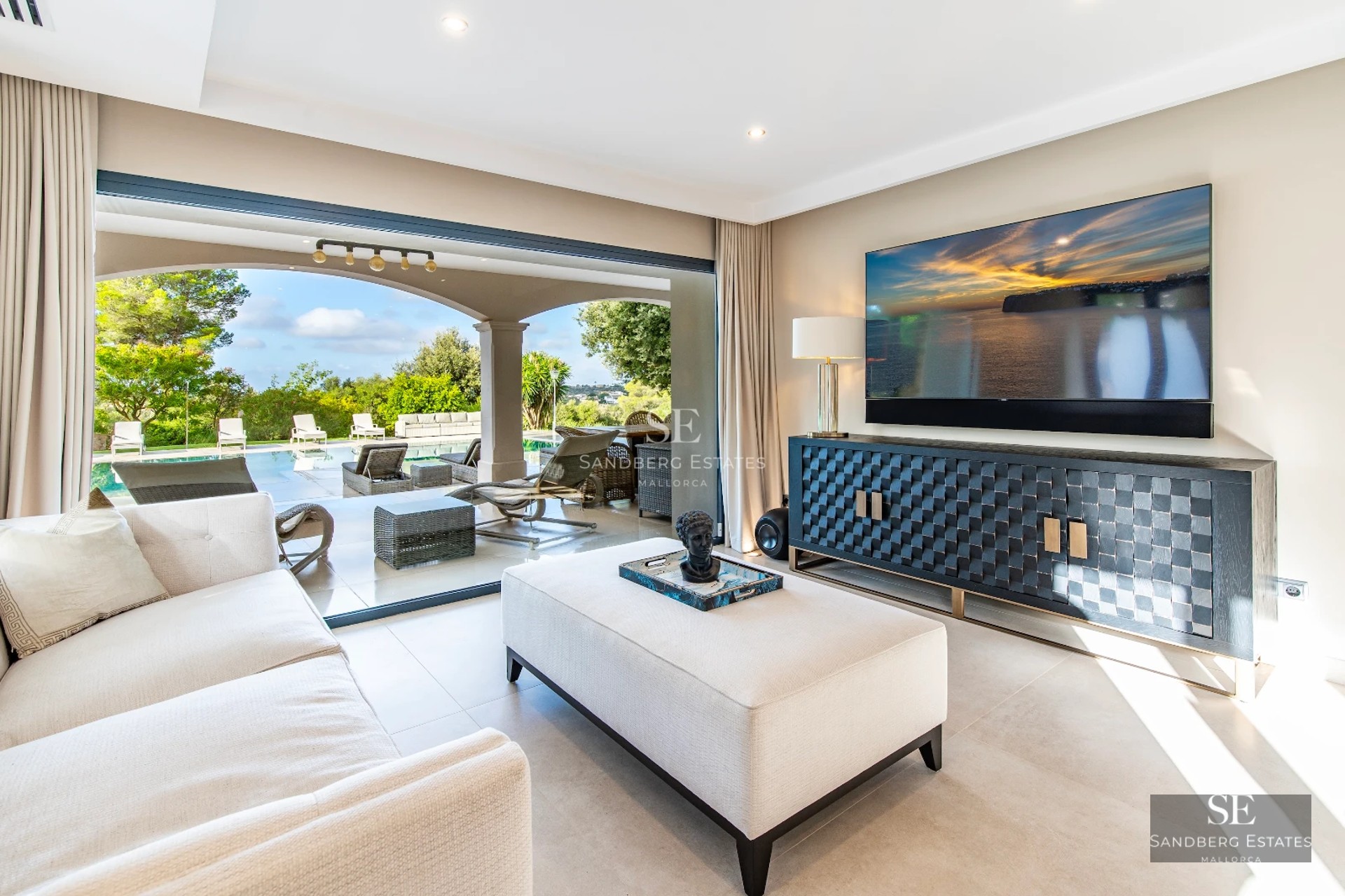 View of a modern infinity pool with lush vegetation. Elegant design, relaxation, and privacy.