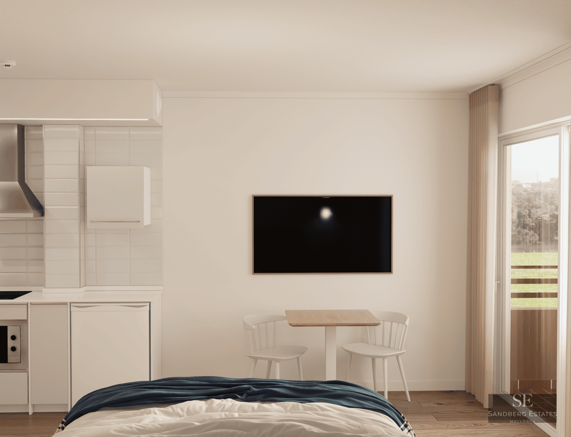 Modern studio featuring a bed, dining area, small kitchen, and balcony access under soft natural light.