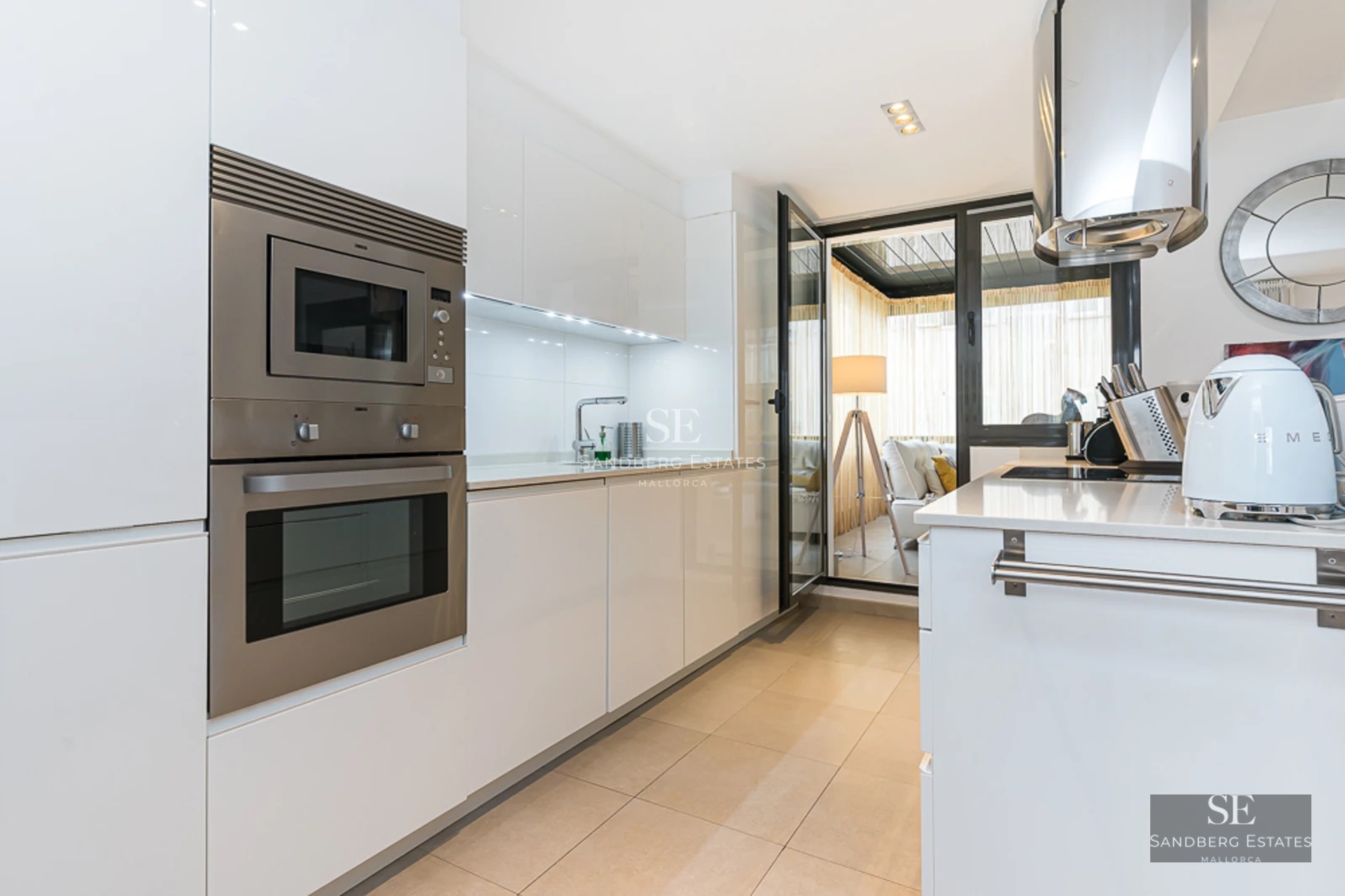 Panoramic view of a modern villa featuring an infinity pool, lush garden, and minimalist architecture. Open spaces and abundant natural light.