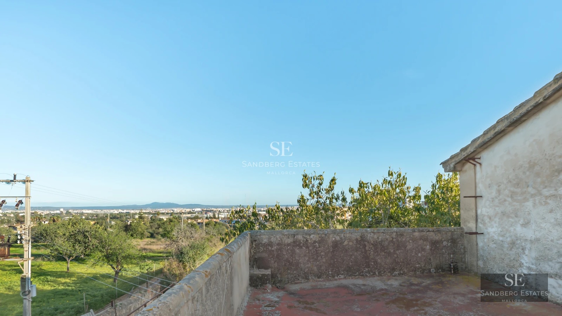 Exterior view of a modern villa with a pool, surrounded by greenery. Minimalist architecture with large windows and spacious terraces.