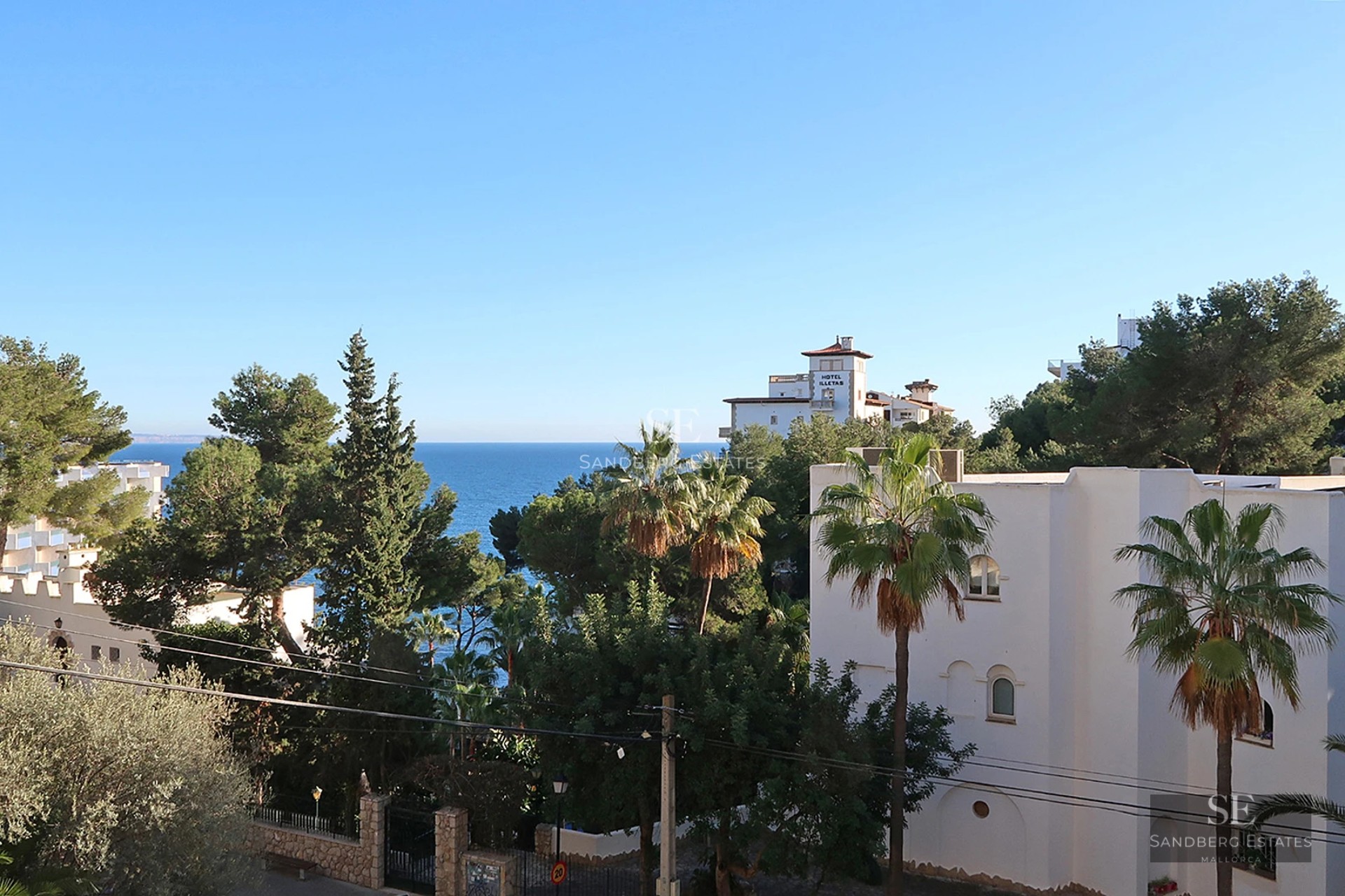 View of modern villa with infinity pool and spacious terraces. Minimalist architecture with large windows and luxury finishes.