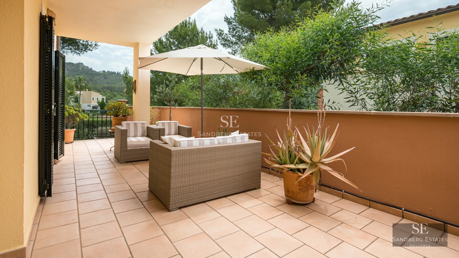 Aerial view of modern villa featuring infinity pool, spacious terraces, minimalist design, and lush gardens. High-quality finishes.