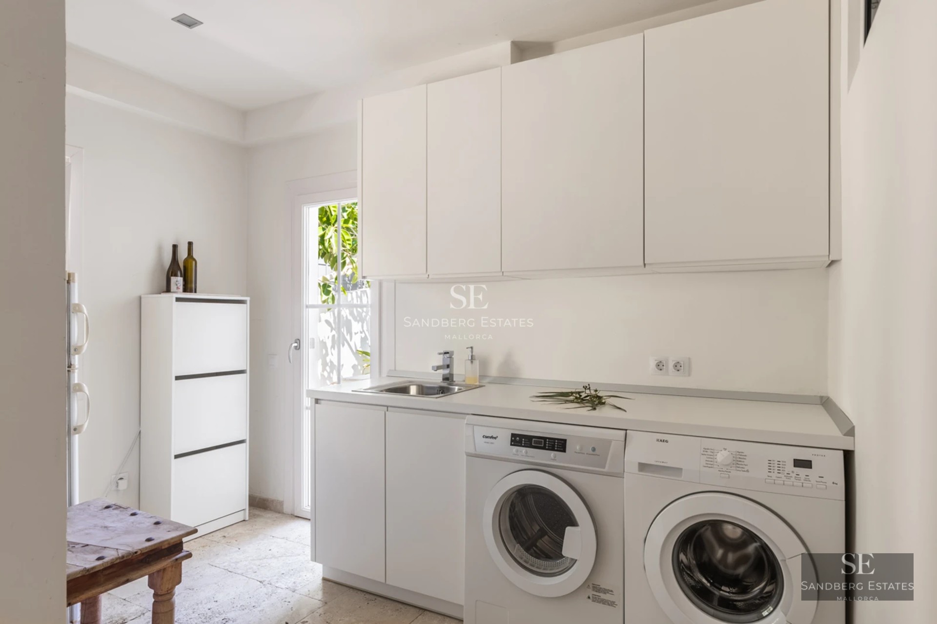 Spacious balcony with panoramic sea views. Modern design, glass railing, and stylish furniture. Soft ambient lighting.