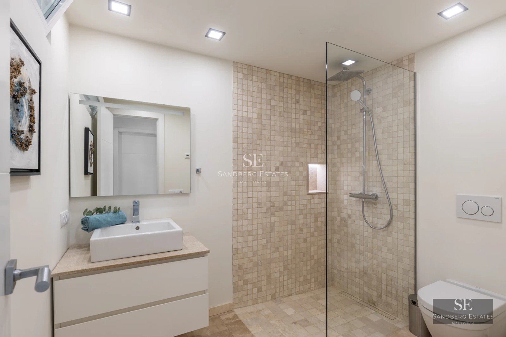 Spacious terrace with infinity pool, sun loungers, and sea view. Modern and minimalist design with lush vegetation.