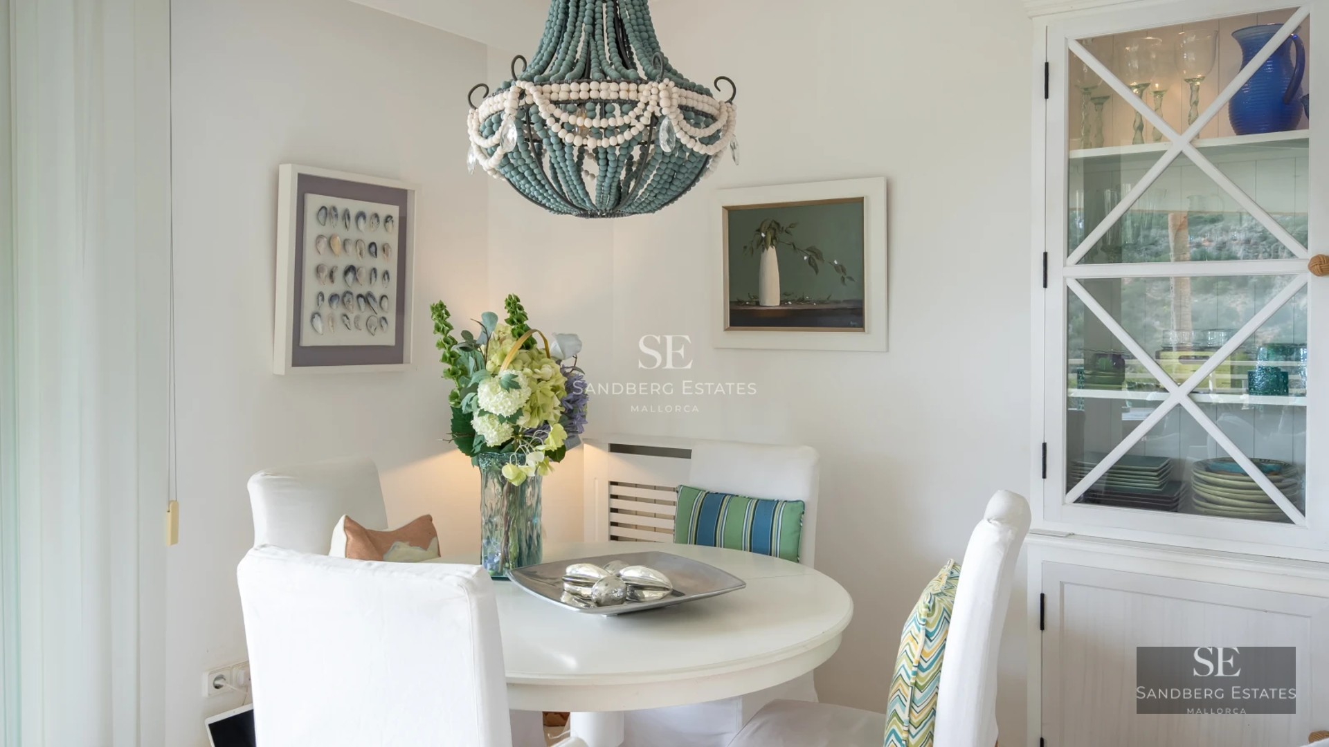 Exterior view of a modern villa with a swimming pool, lush landscaping, and expansive terraces. Minimalist architecture with large windows.