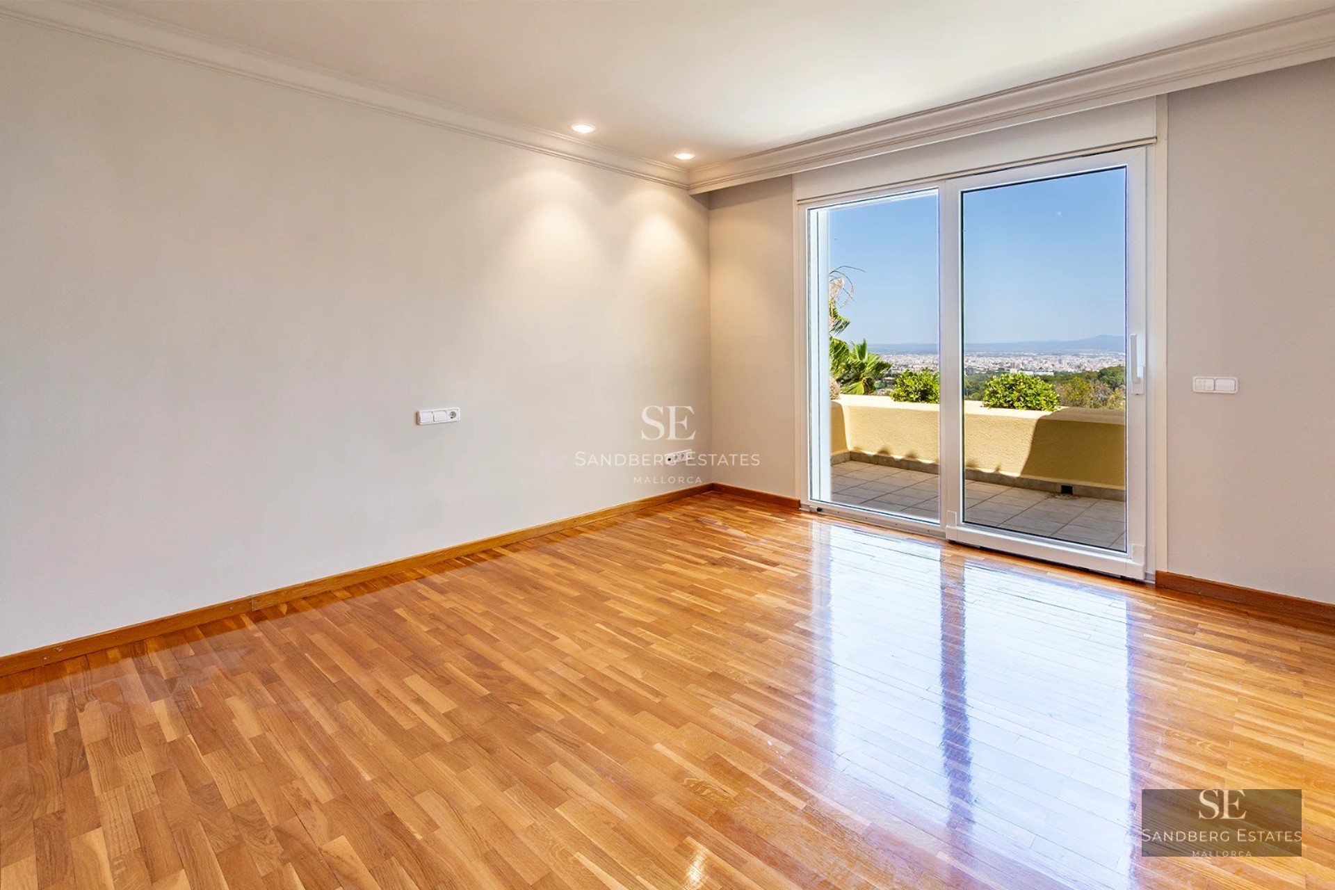 Spacious terrace with infinity pool and panoramic views. Modern design with elegant furniture and lush gardens.