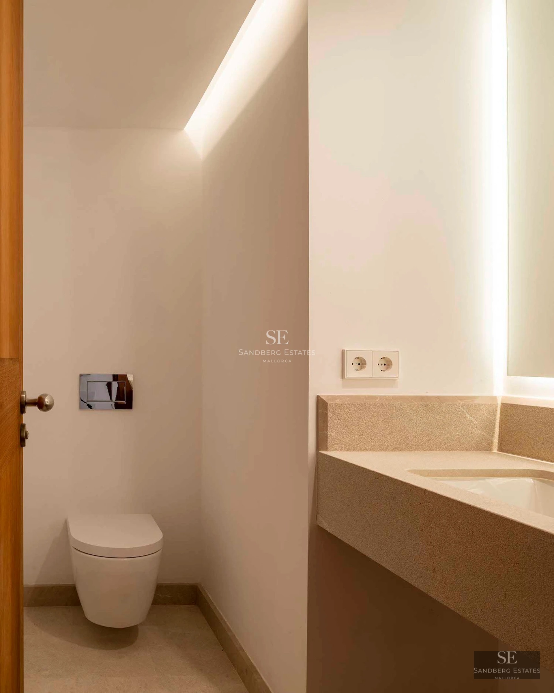 View of a lush garden with pool, modern furniture, and elegant architecture. Warm lighting and relaxing atmosphere.