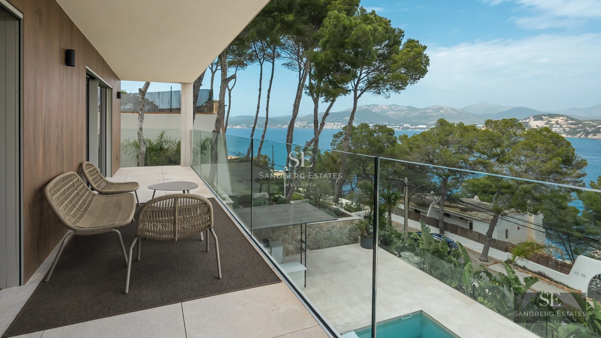 Expansive terrace with infinity pool, sun loungers, and sea views. Modern, elegant, and spacious design. Ideal for relaxation.