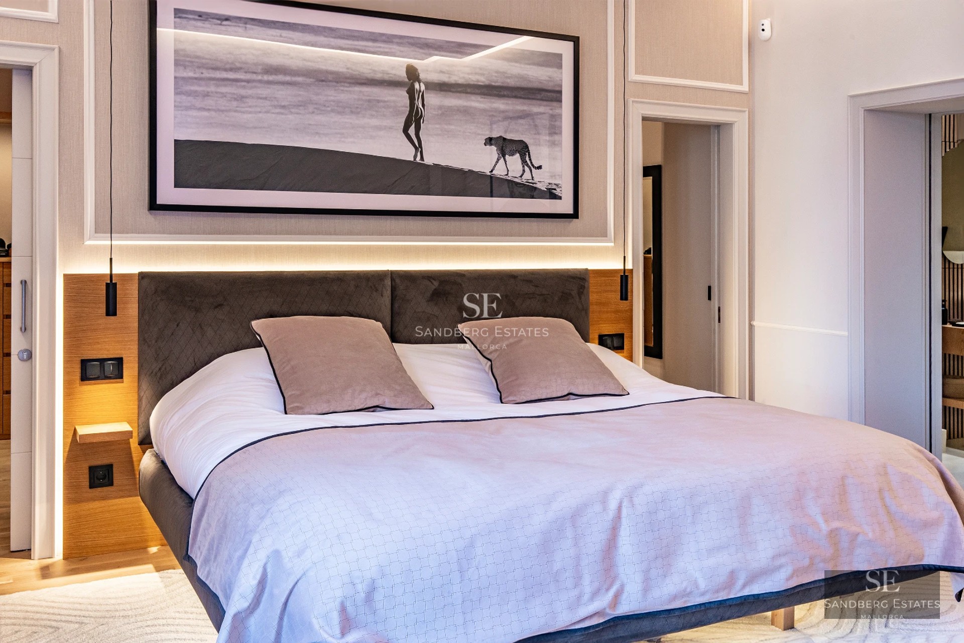 Spacious living room with infinity pool. Large windows, modern design, natural lighting, and neutral color palette.