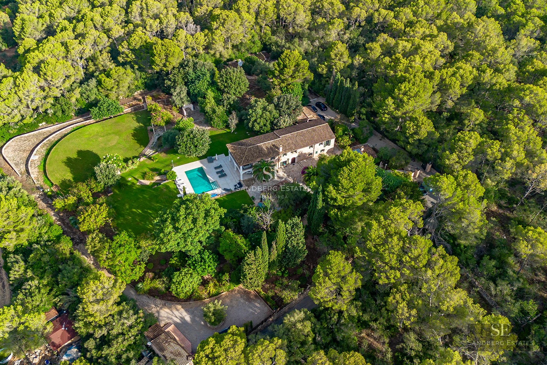 Spacious terrace with pool, sun loungers, and panoramic views. Modern design, ideal for relaxation and entertainment.