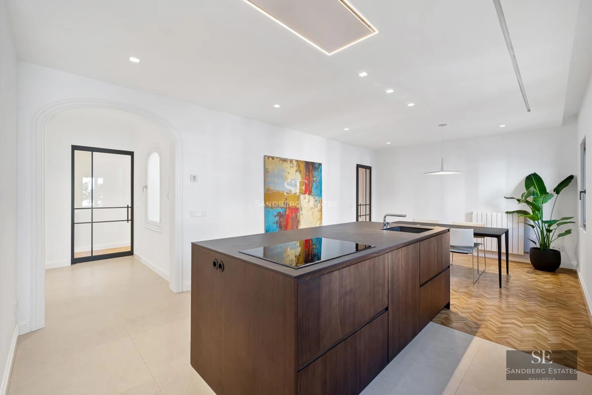 Exterior view of a modern villa with reflecting pool, surrounded by gardens and minimalist architecture. Warm lighting and sleek design.