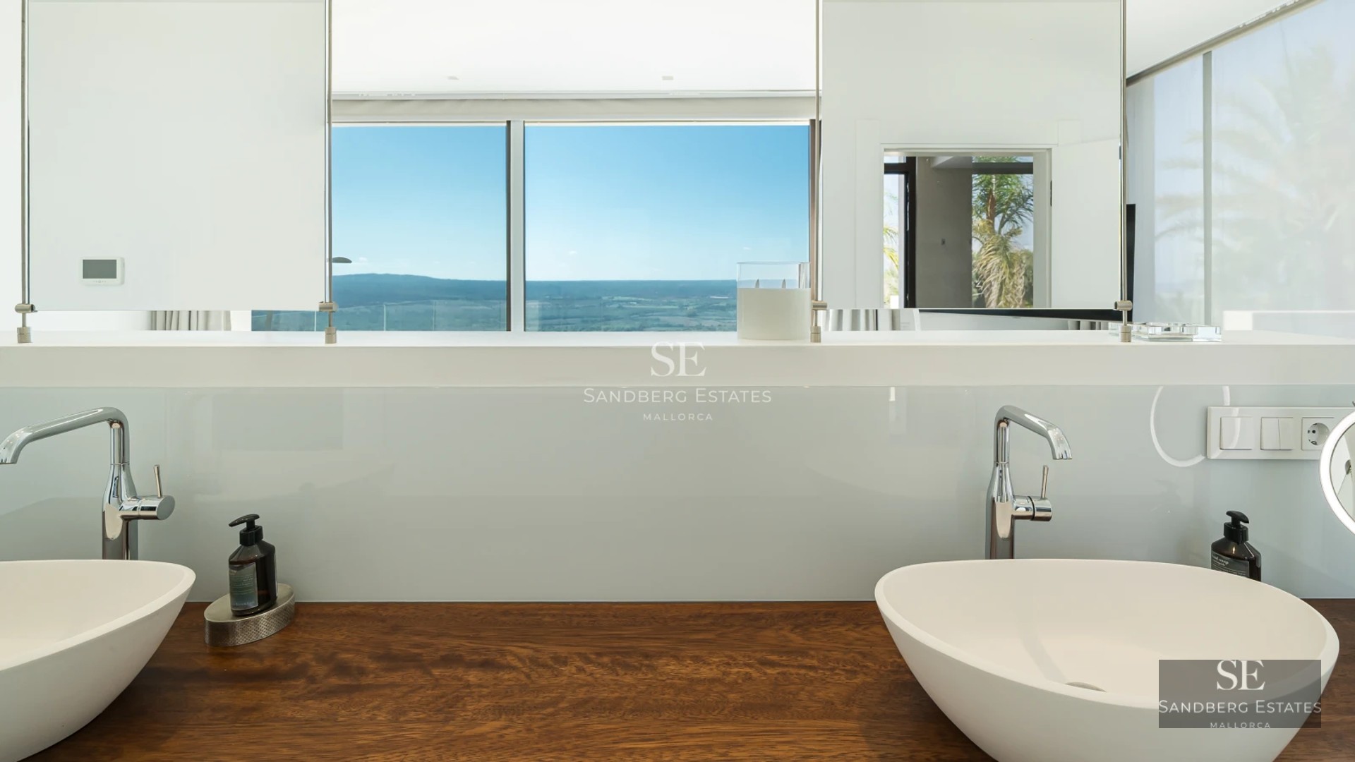 Modern exterior with infinity pool and sea view. Minimalist architecture, clean lines, and spacious terraces. Well-maintained garden.