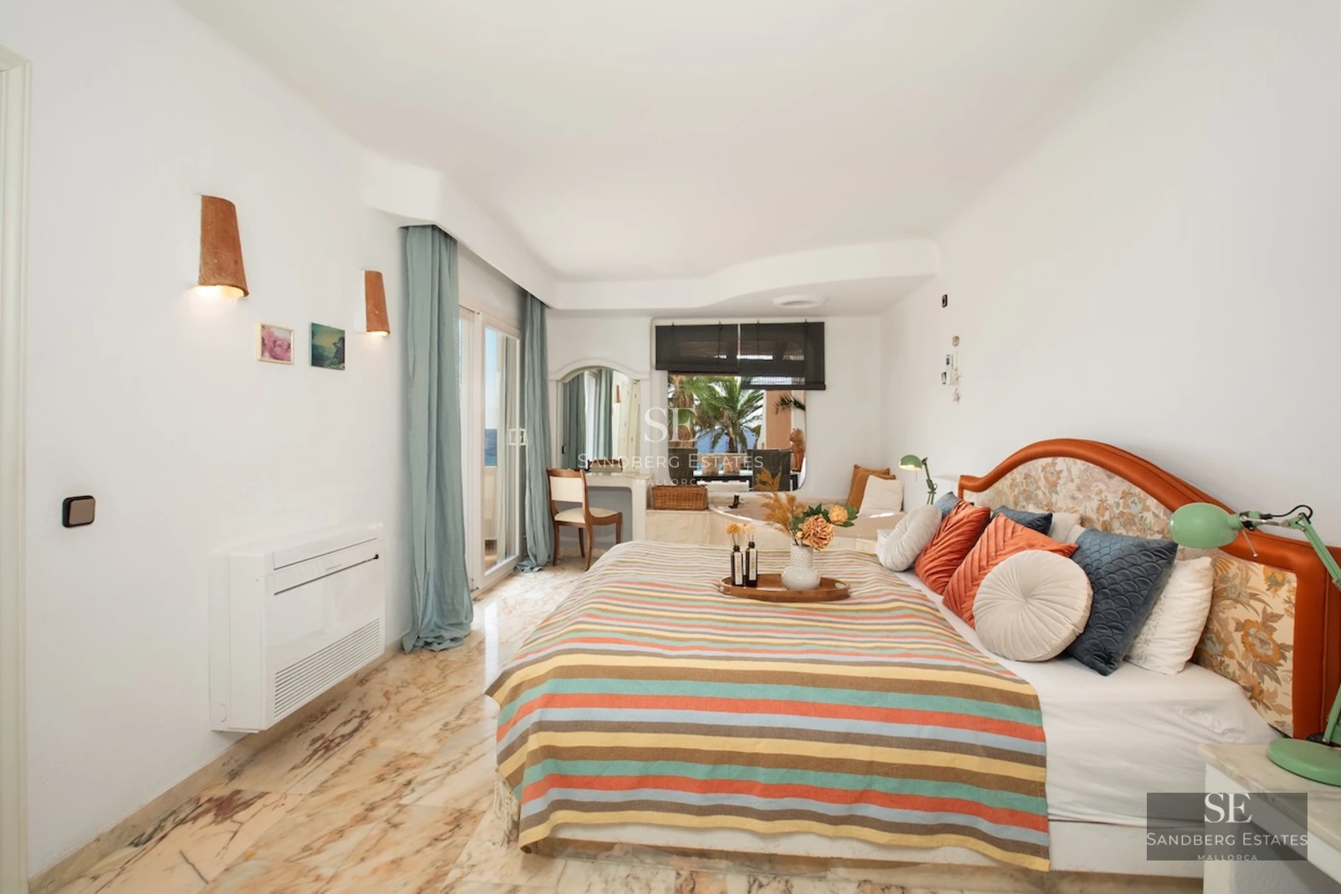 Exterior view of a luxurious villa featuring an infinity pool, garden, and modern architecture with large windows.