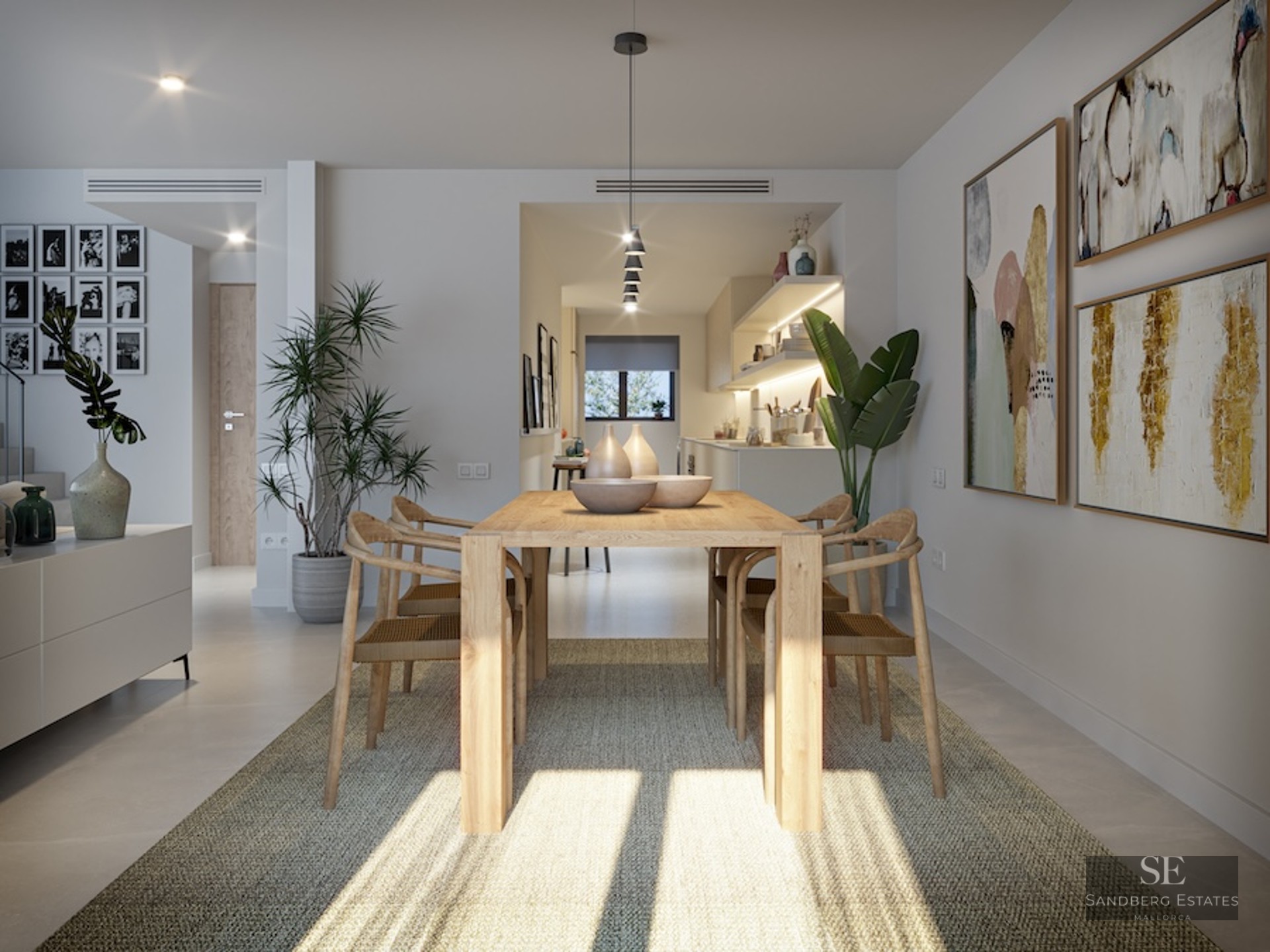Bright dining area with light wood table, designer chairs, woven rug, and large abstract wall art.