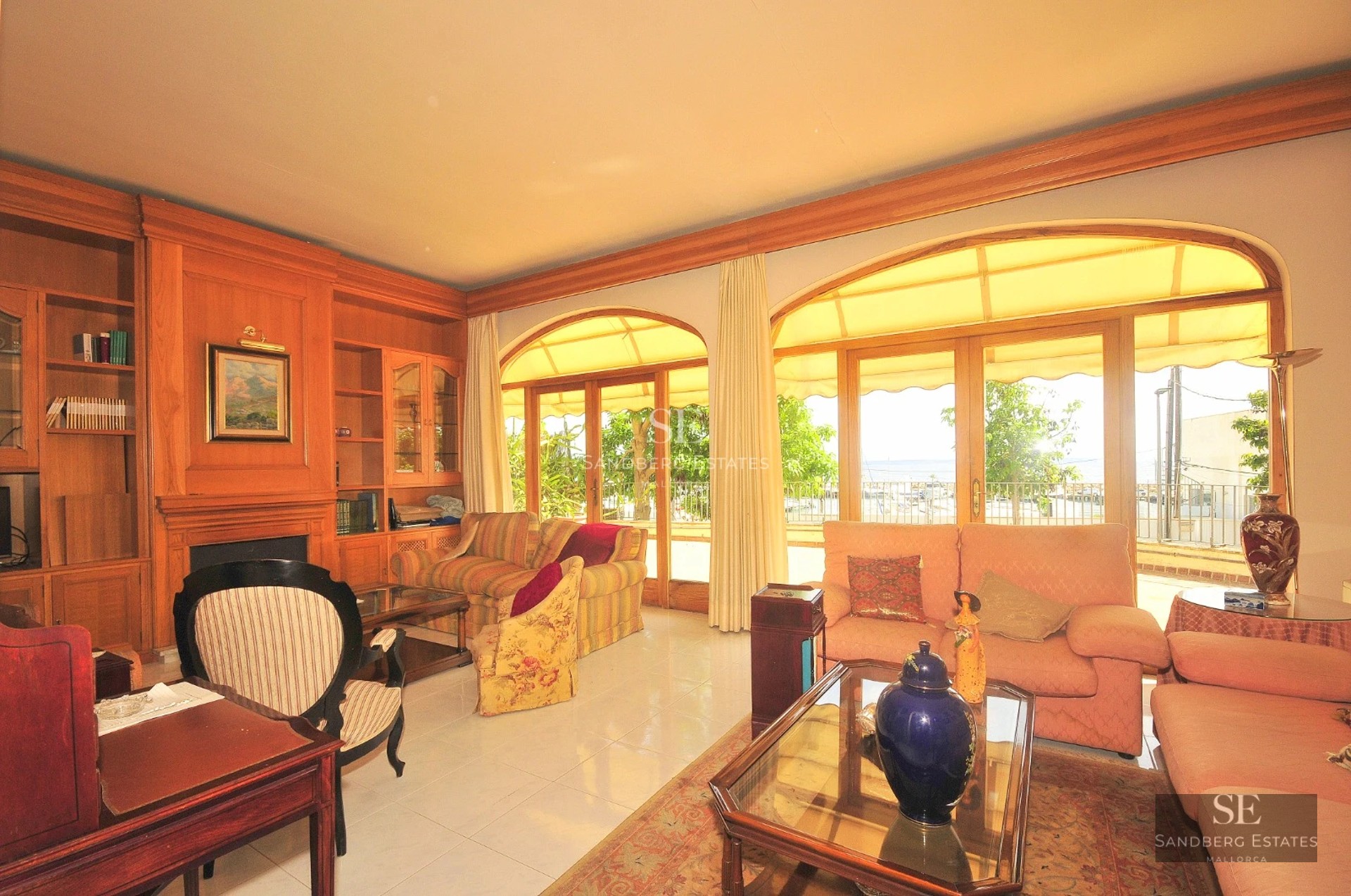 Contemporary villa with reflecting pool, large windows, and lush garden. Minimalist and elegant design with ambient lighting.