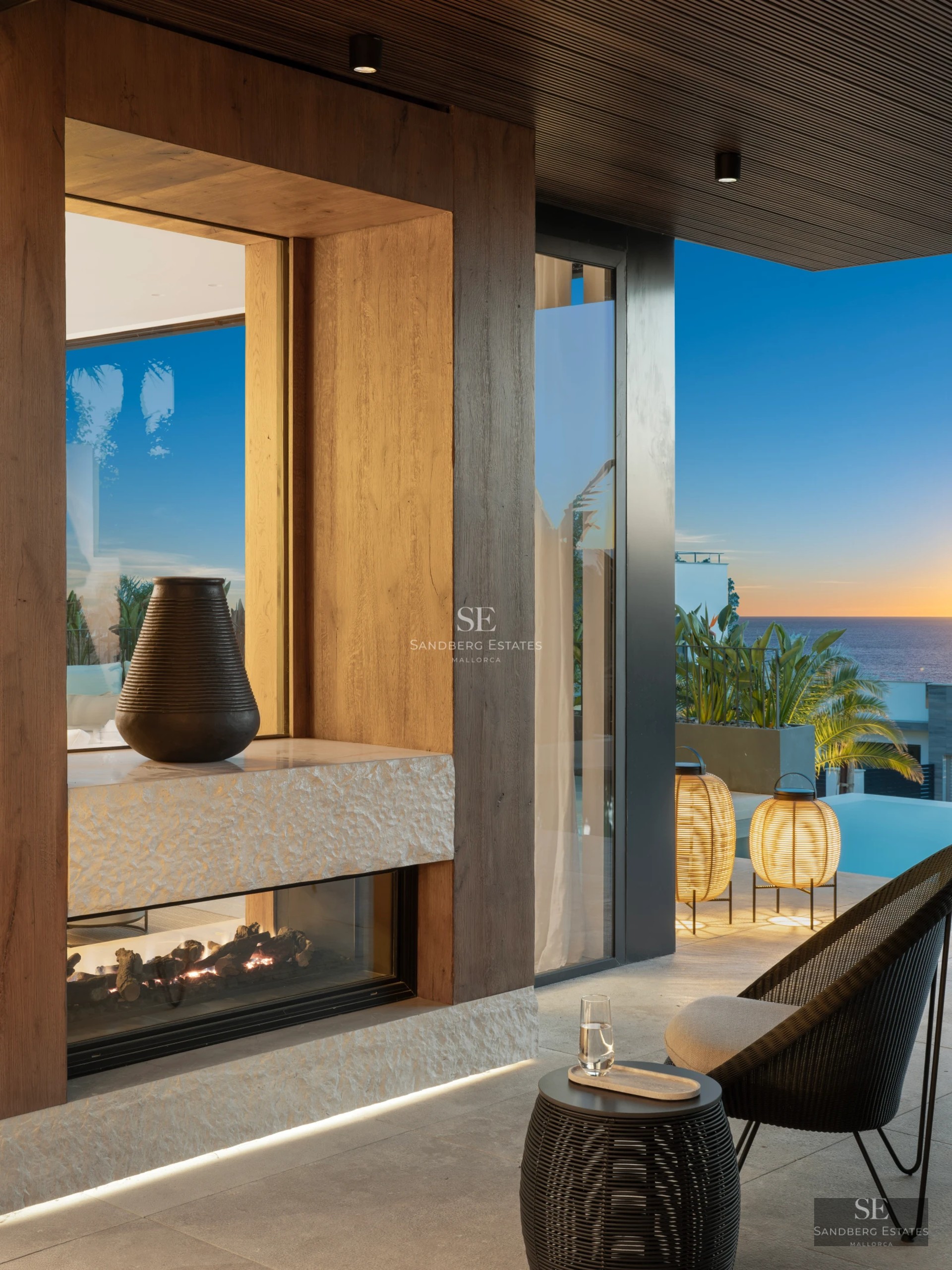 Exterior view of a modern villa featuring a pool, landscaped gardens, and spacious terraces. Contemporary architectural design with high-quality finishes.