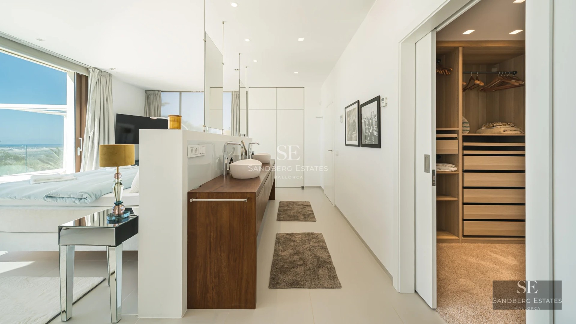 Exterior view of a modern villa with pool, lush gardens, and contemporary architecture.