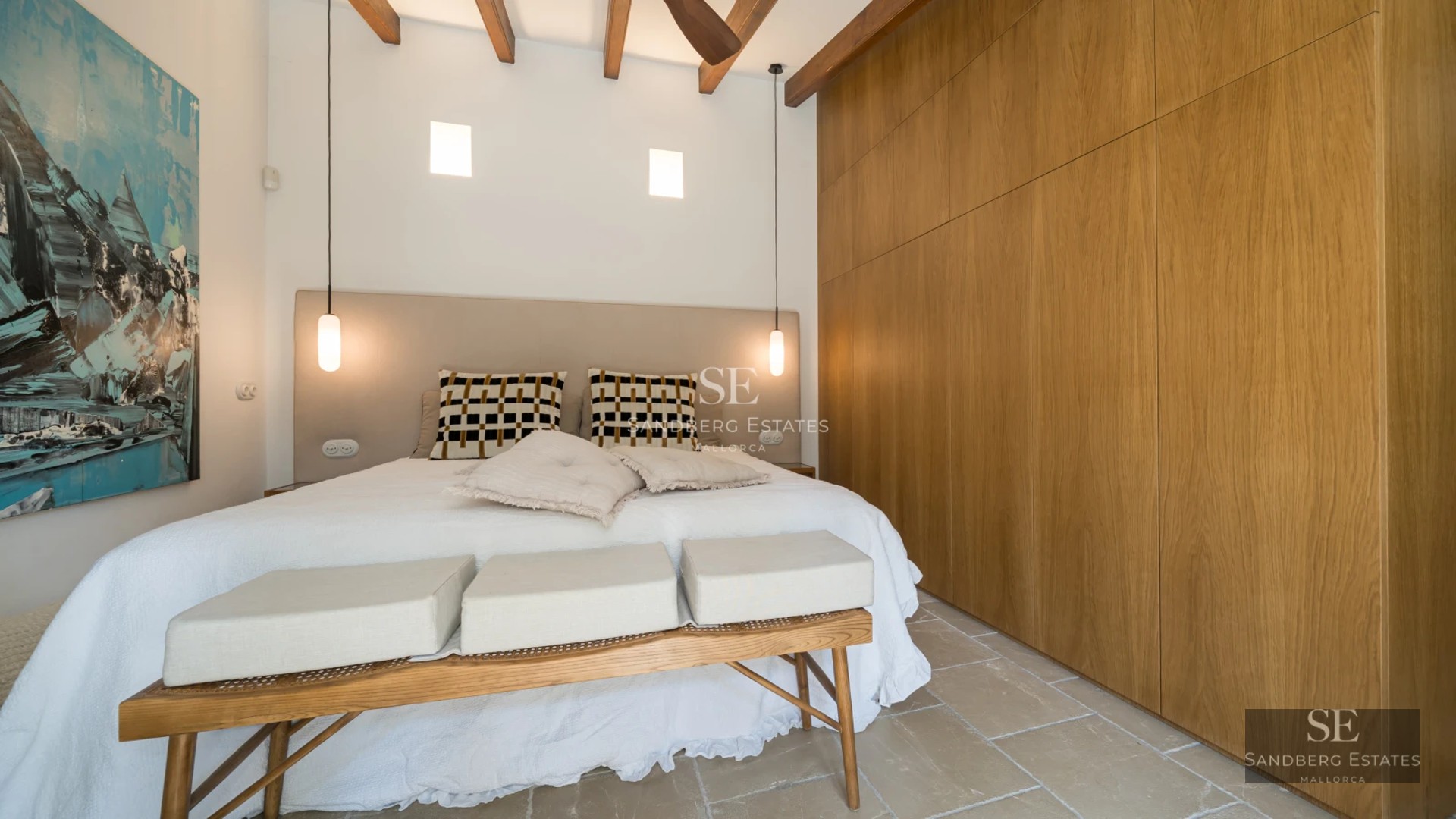 Exterior view of modern villa featuring infinity pool, lush gardens and minimalist architecture under a sunny sky.