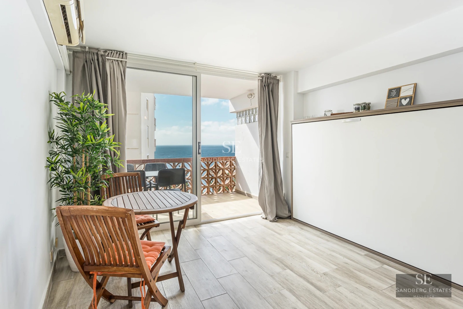 Spacious terrace with pool, sun loungers, and views. Modern design with high-quality materials. Natural lighting.