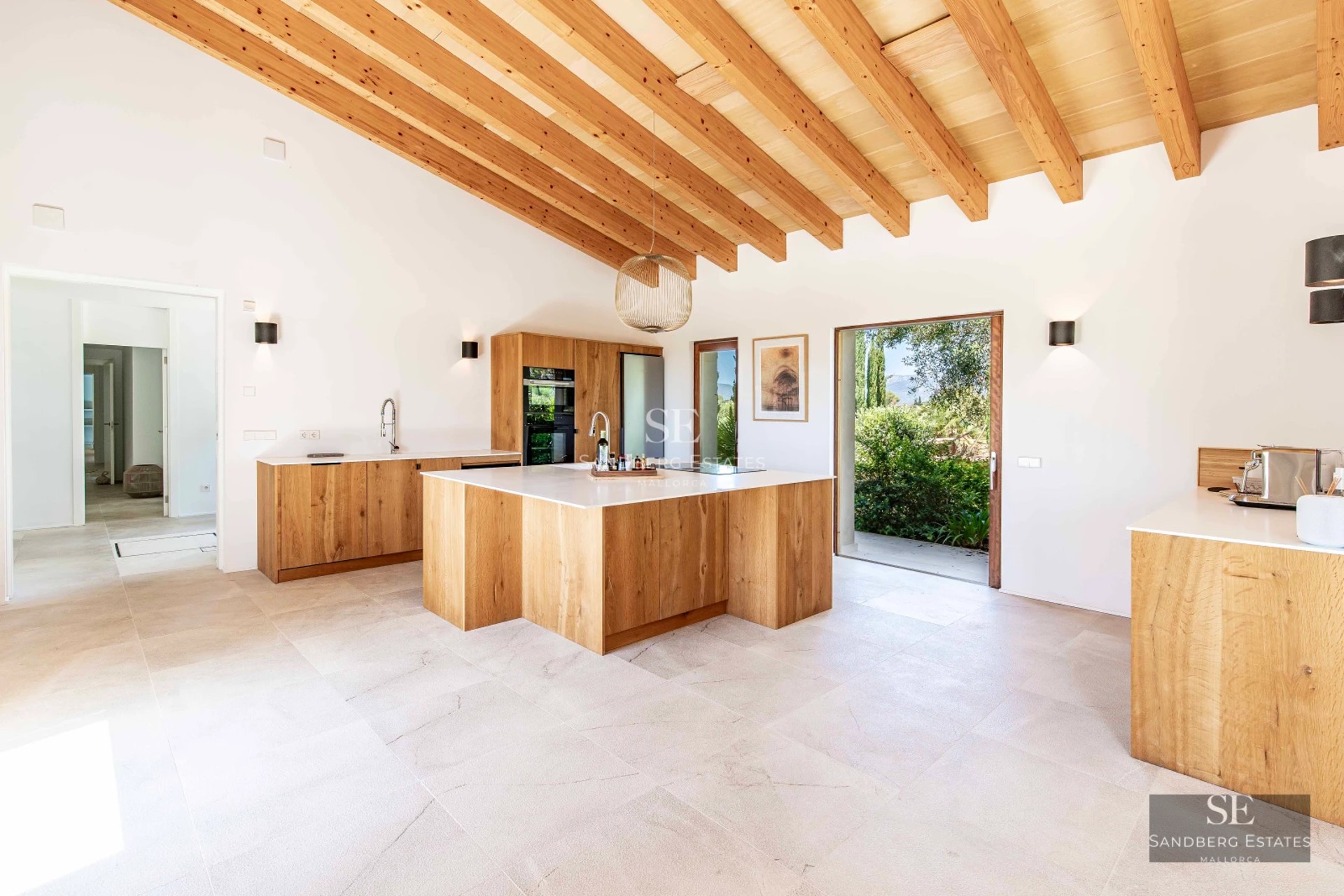 Spacious balcony with panoramic sea views. Modern design with outdoor furniture and glass railing.