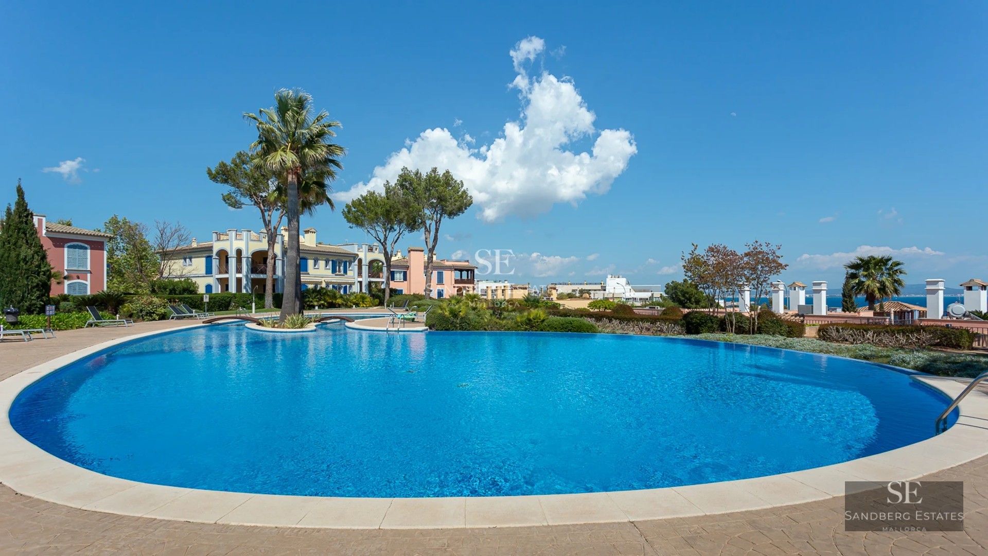 Exterior view of a modern villa featuring an infinity pool, spacious terraces, and a lush garden. Minimalist architecture and luxury design.