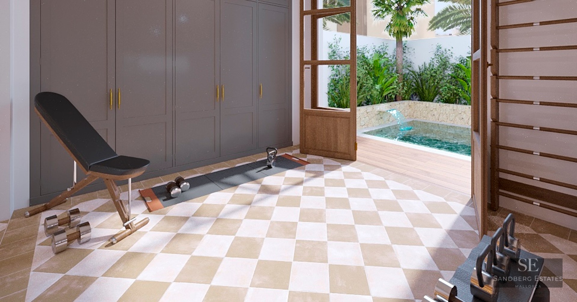 Indoor home gym with weights and bench, open to a tropical courtyard with a small pool and stone wall.