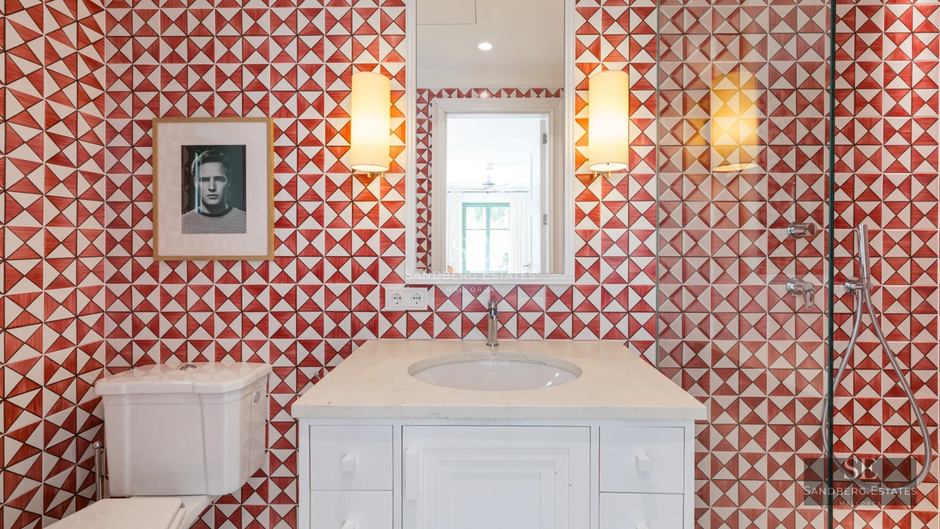 Spacious balcony with panoramic sea views. Stylish outdoor furniture and light wood flooring. Modern and bright design.