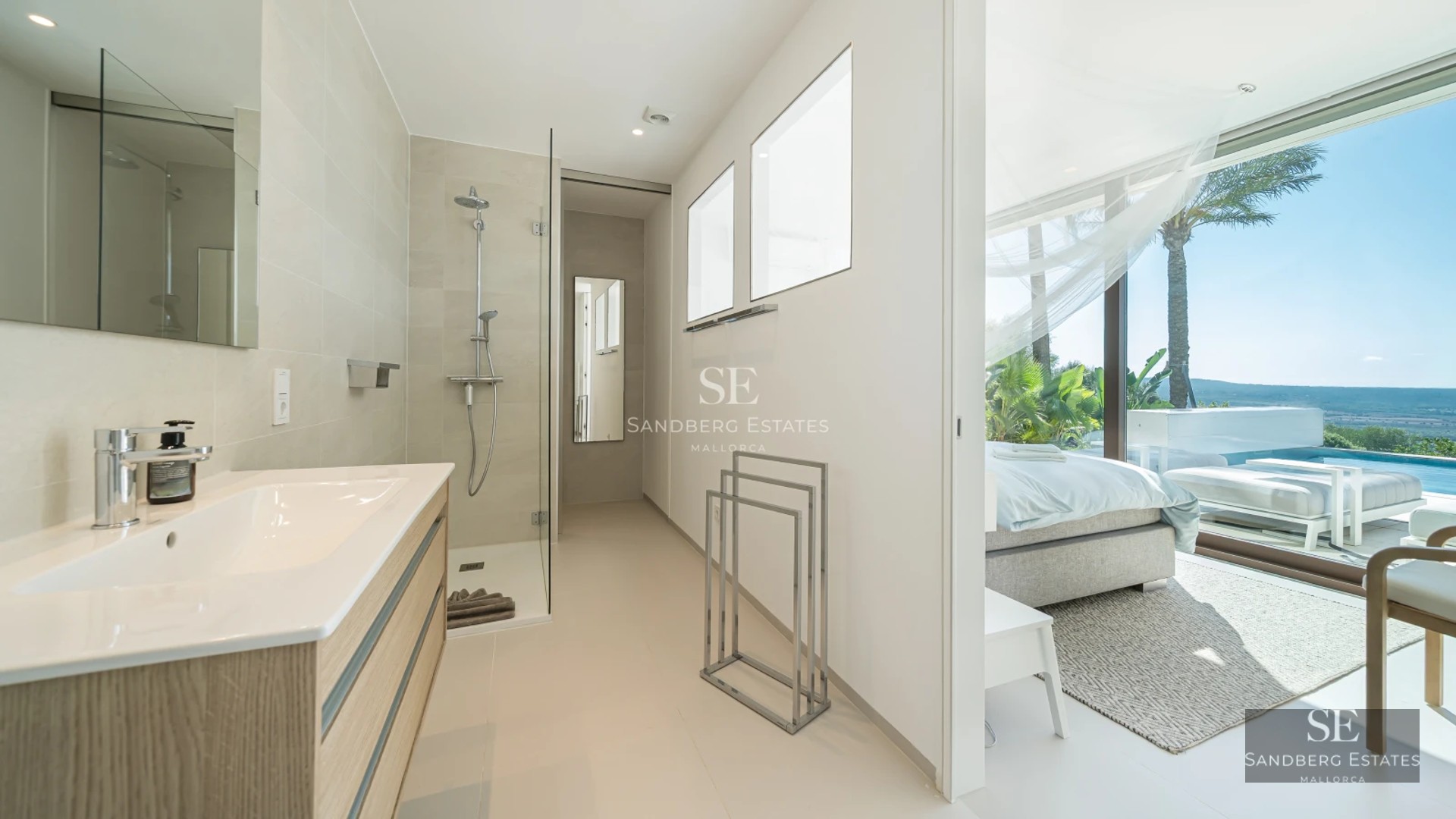 Modern balcony with glass railing, stunning view, stylish outdoor furniture, and wooden flooring. Minimalist and bright design.