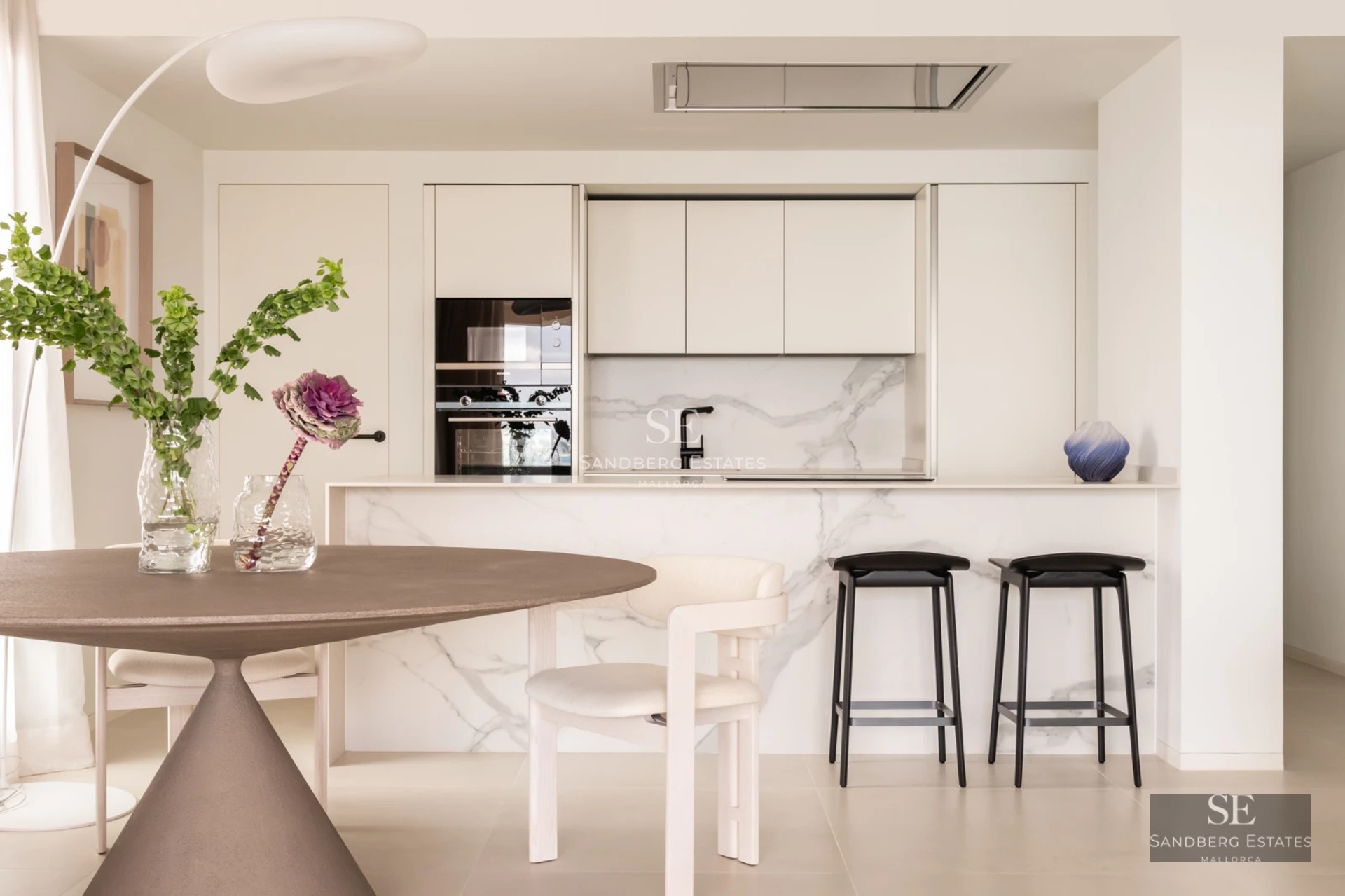 Expansive terrace featuring an infinity pool, sun loungers, and ocean views. Modern design with high-quality finishes. Bright and spacious.