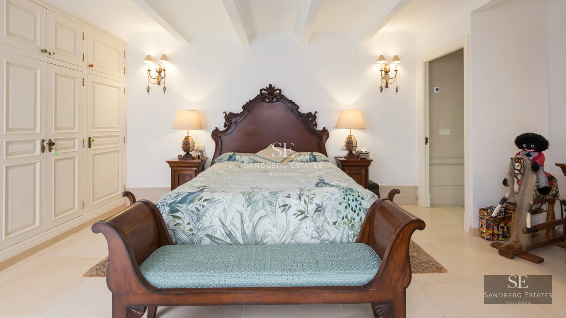 Exterior of a modern house with infinity pool, manicured garden, and large windows offering panoramic views.