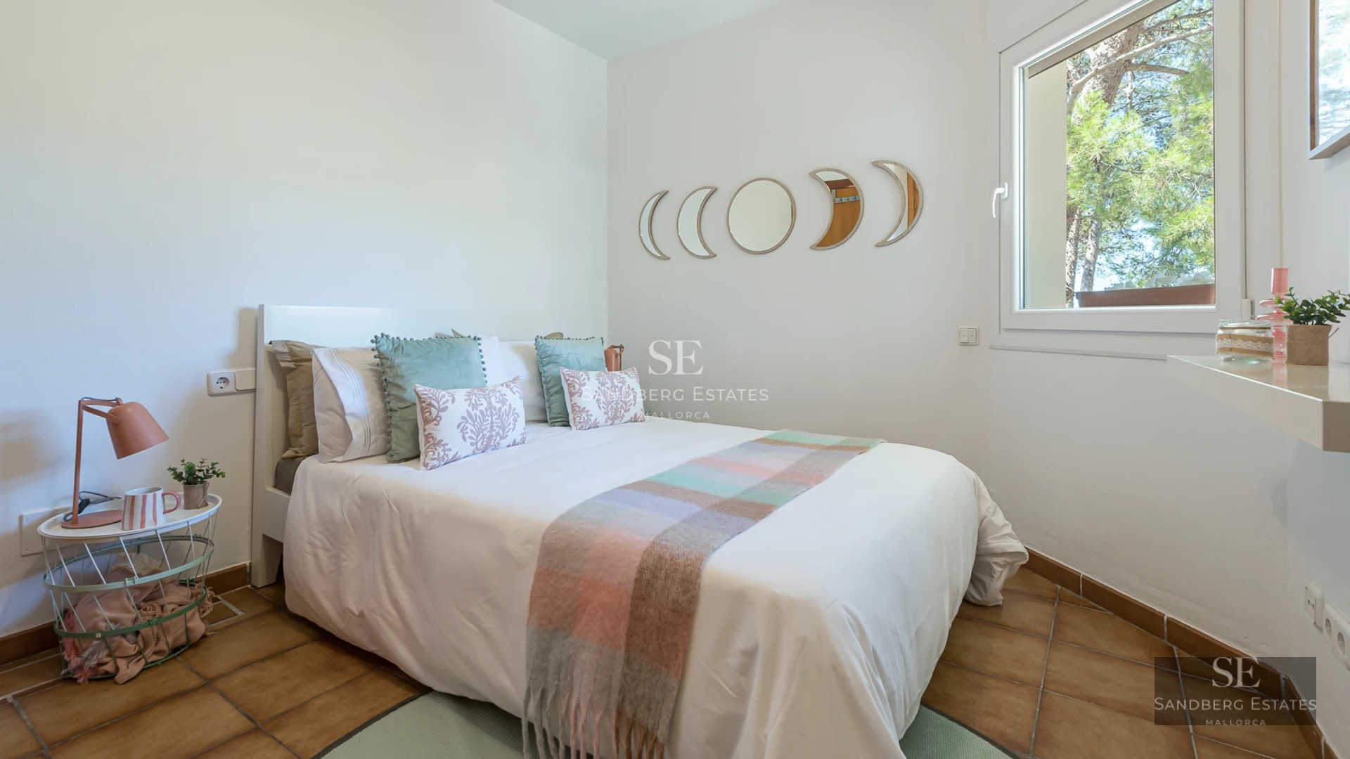 Spacious terrace with infinity pool, stylish sun loungers, and panoramic views. Modern architecture with clean lines and lush vegetation.