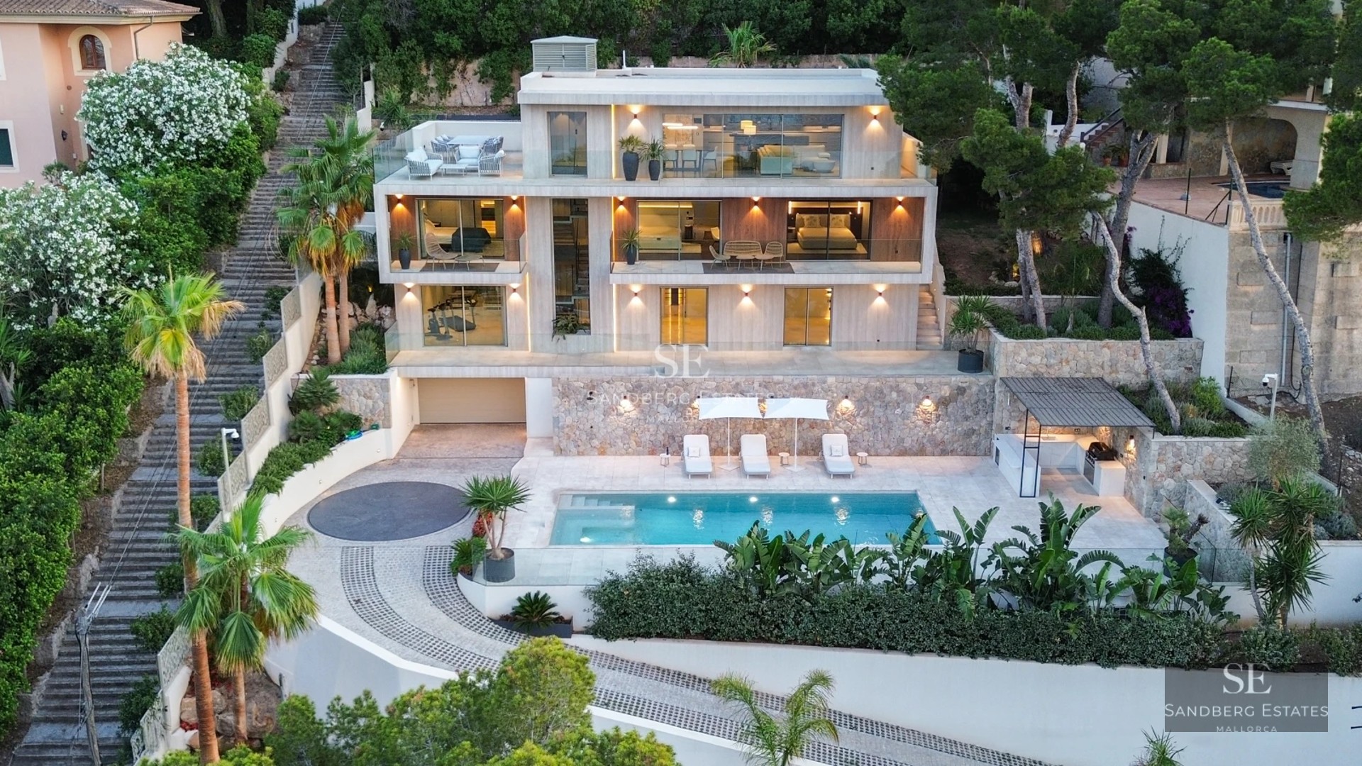Exterior view of a modern house with pool, lush garden, and minimalist design. Natural lighting and large windows.