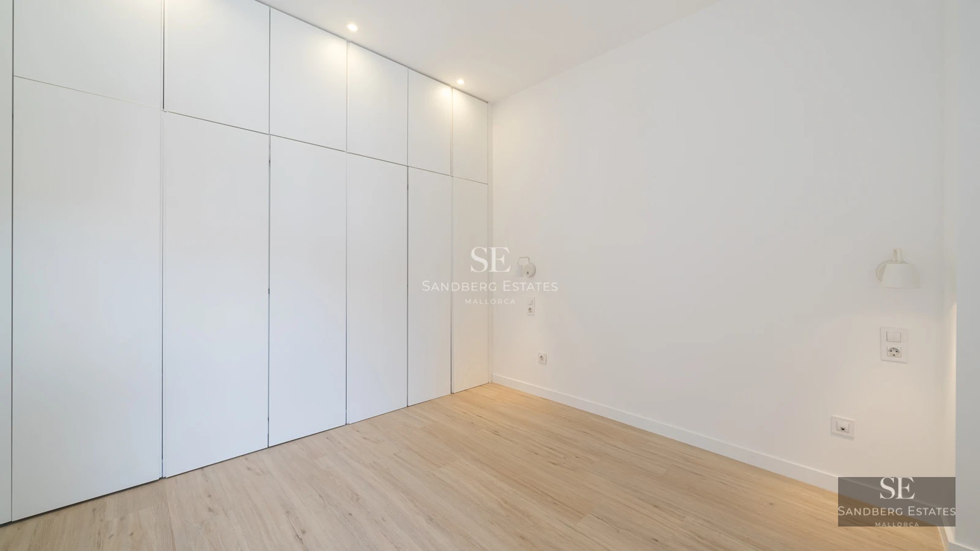 View of infinity pool with lush garden and modern architecture. Elegant interior with natural light and panoramic views.