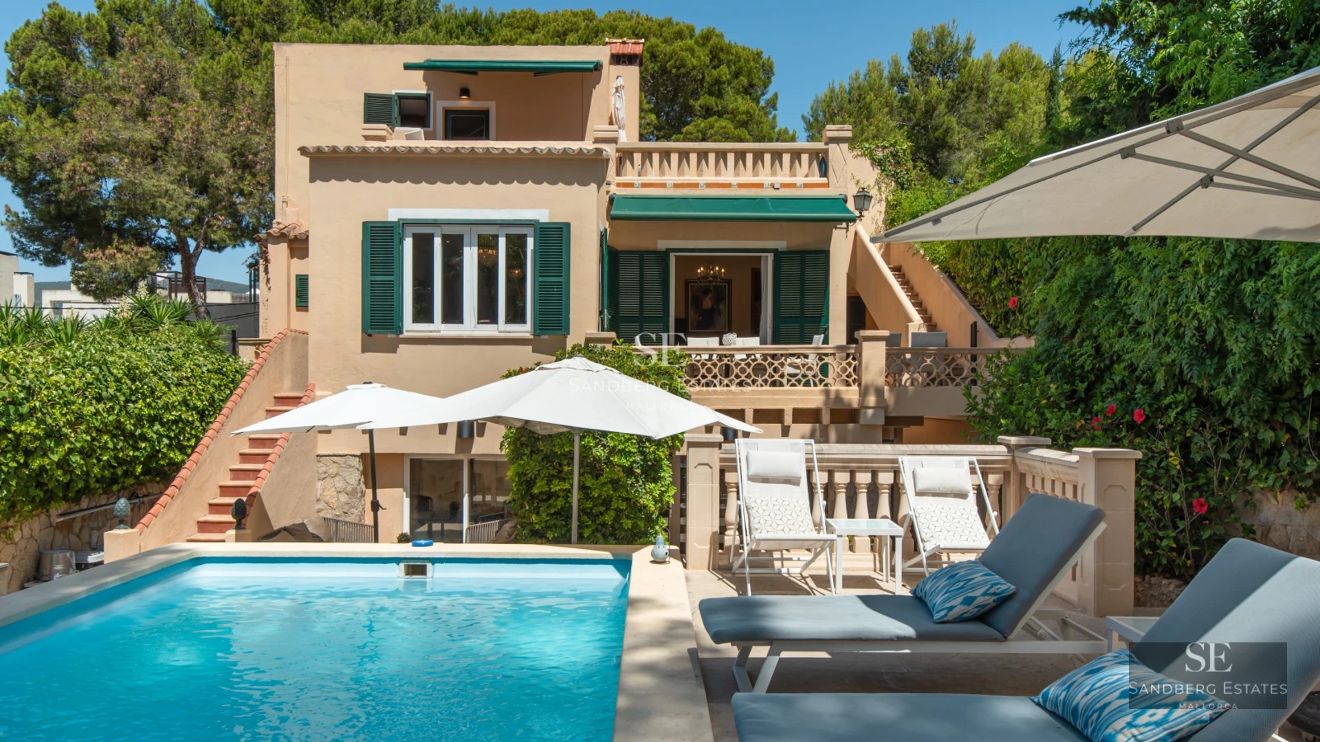 Spacious terrace with pool, sun loungers, and panoramic views. Modern design with ambient lighting. Ideal for relaxation and entertainment.