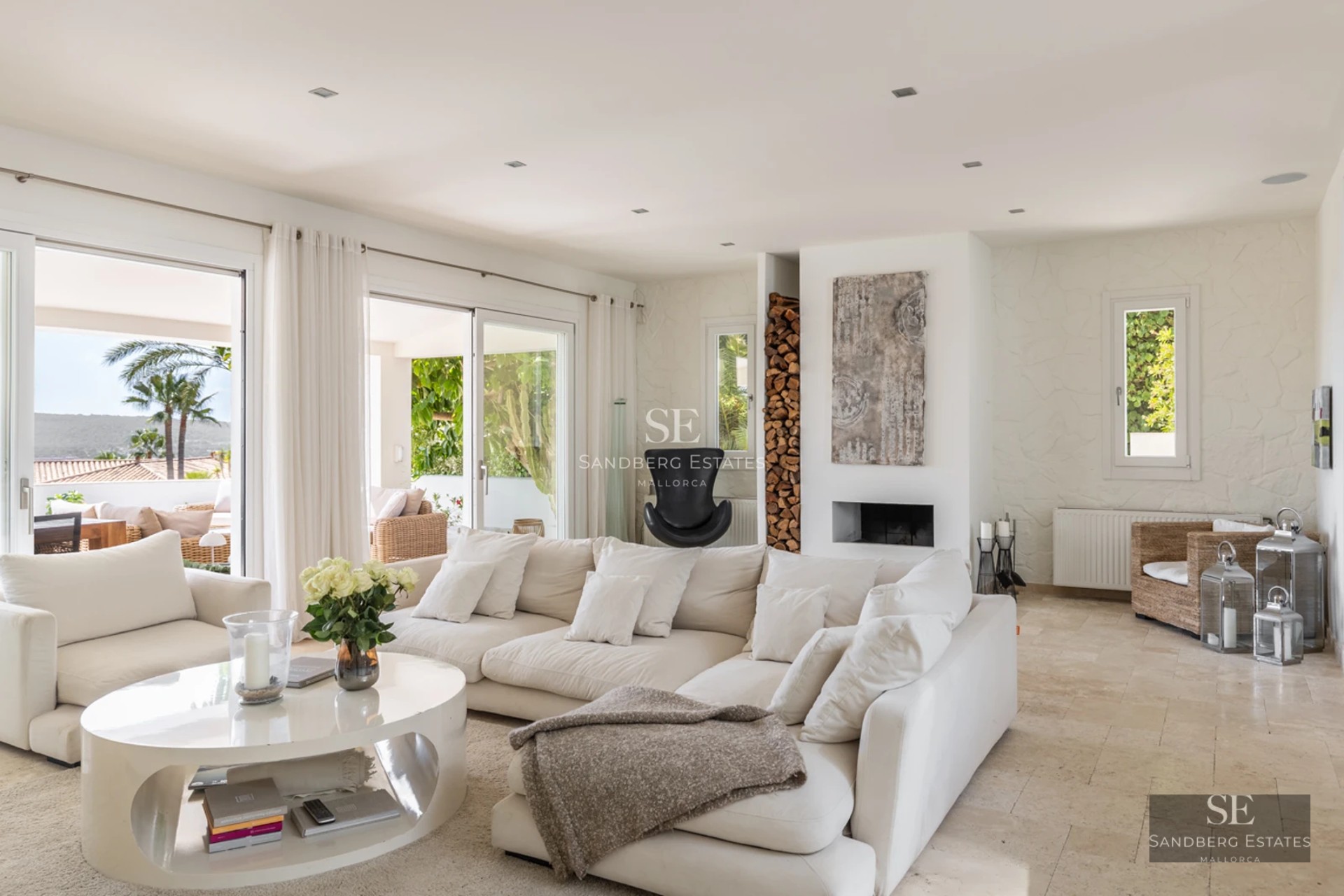 Spacious balcony with panoramic sea views. Modern design, glass railing, and elegant outdoor furniture.