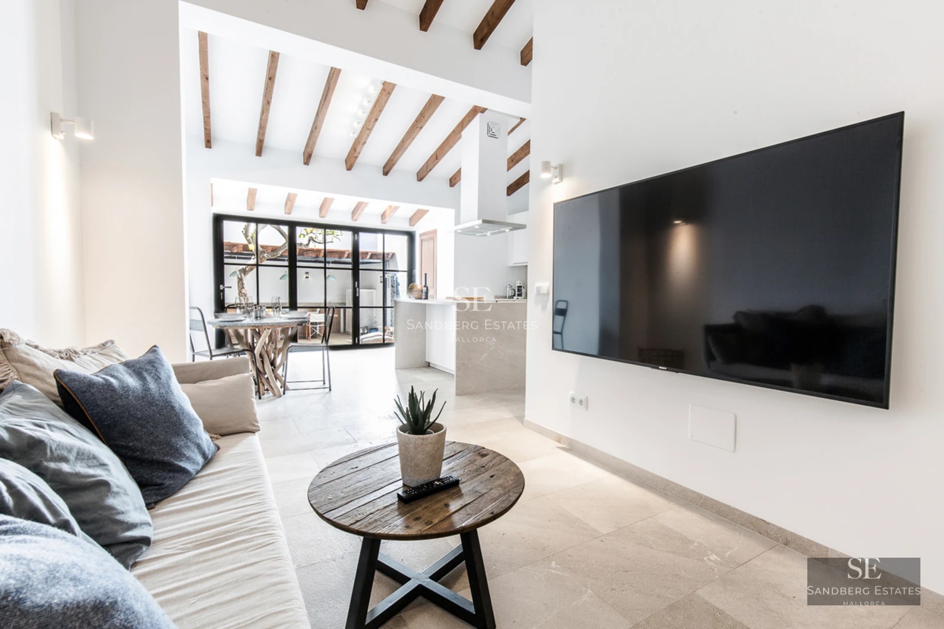 Modern balcony with glass railing, grey tiled floor and stunning views of the city skyline and sky. Minimalist design.