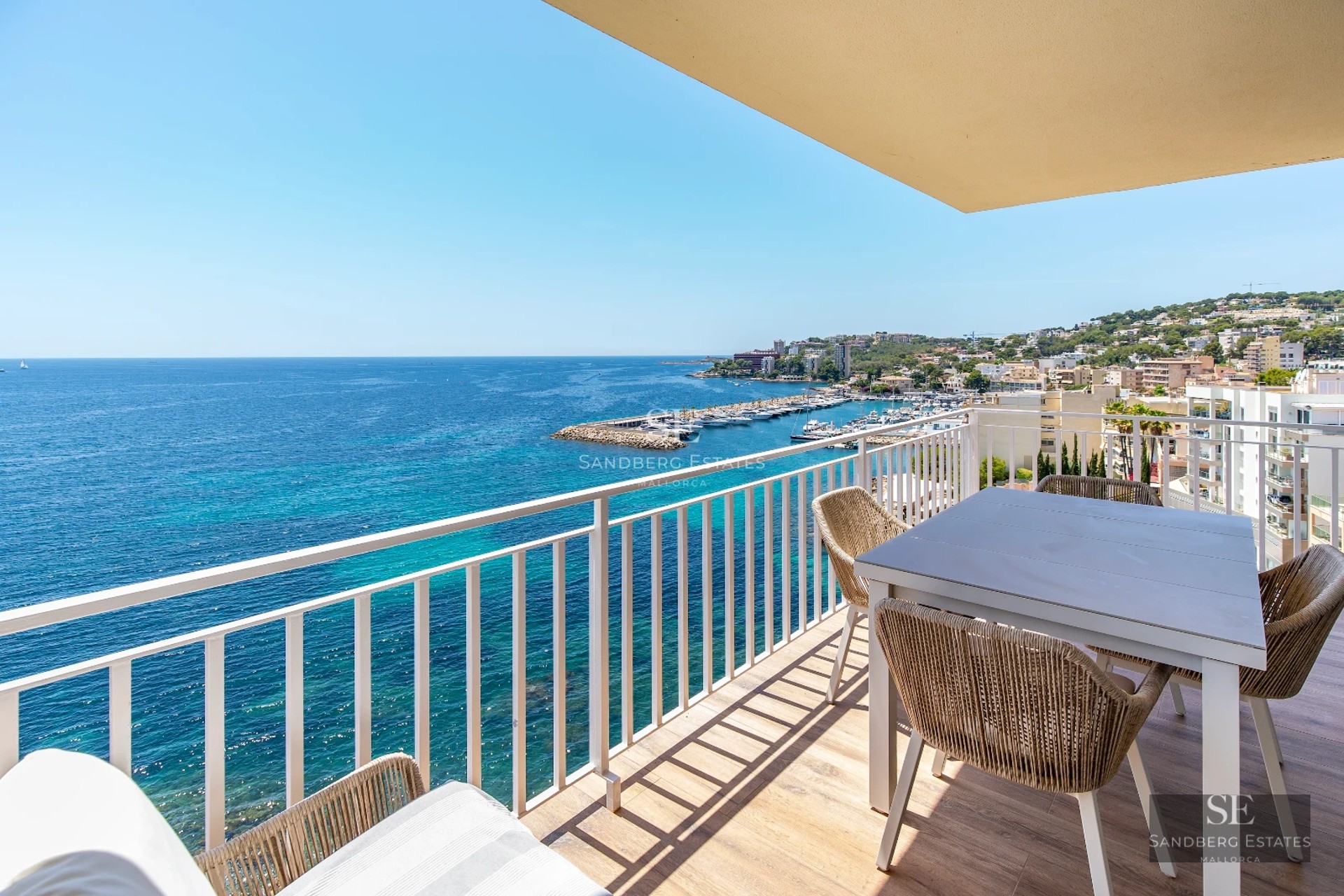 View of a modern villa with infinity pool, sun loungers, garden and large windows. Minimalist and luxurious architecture.