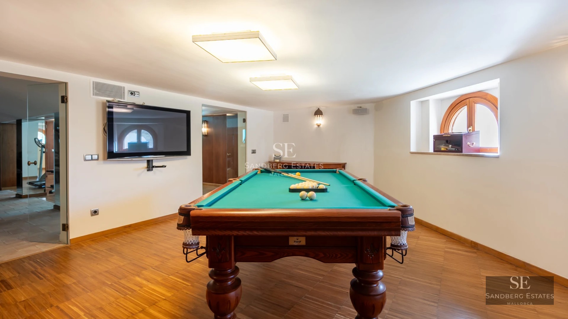 Panoramic view of a modern villa featuring a pool, lush garden, and spacious terraces. Cutting-edge architectural design with luxury finishes.