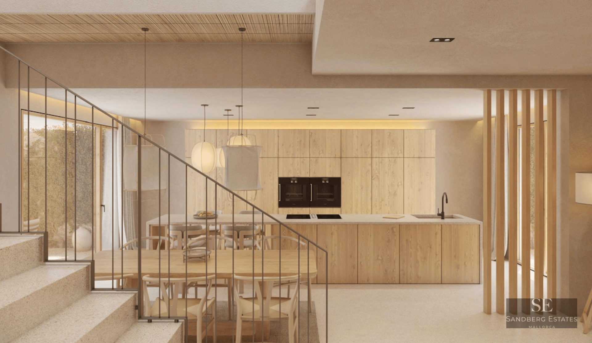 View of a modern kitchen with a wood island, dining area with Wishbone chairs, and a minimalist stone staircase.