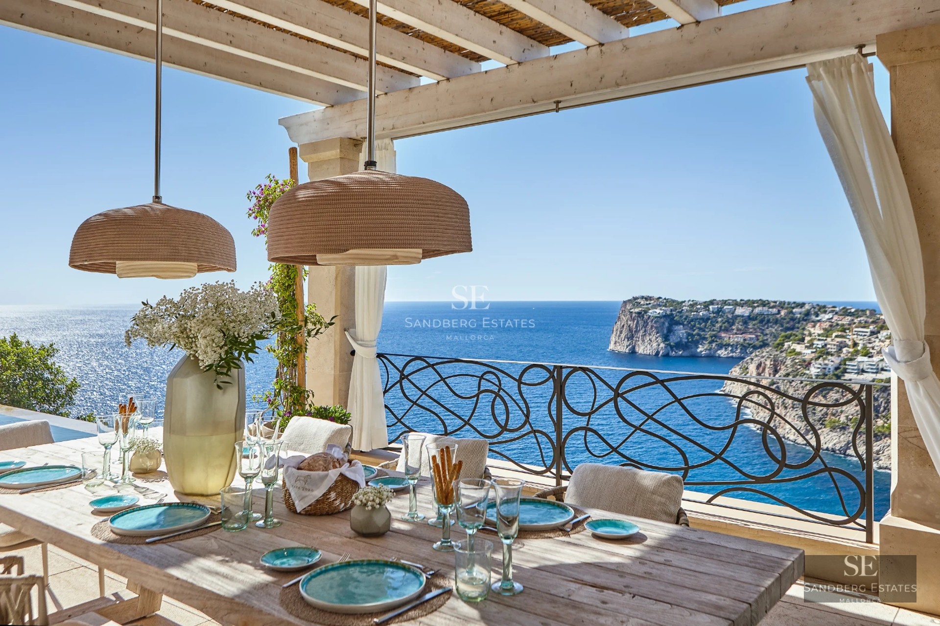 Expansive terrace featuring an infinity pool, sun loungers, and panoramic views. Modern design with sleek finishes. Ideal for relaxation and entertainment.