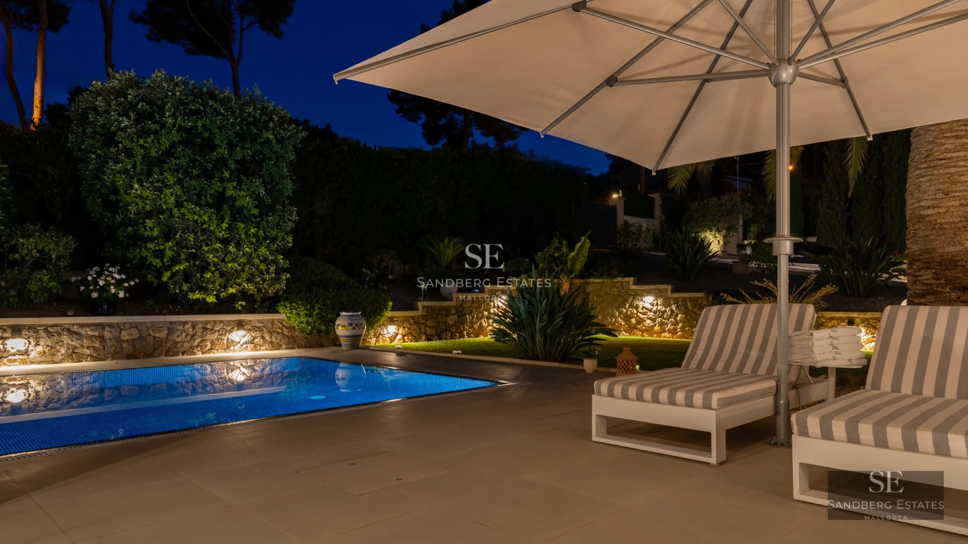 Exterior view of modern villa with pool. Minimalist architecture, large windows, lush garden, and landscape design.