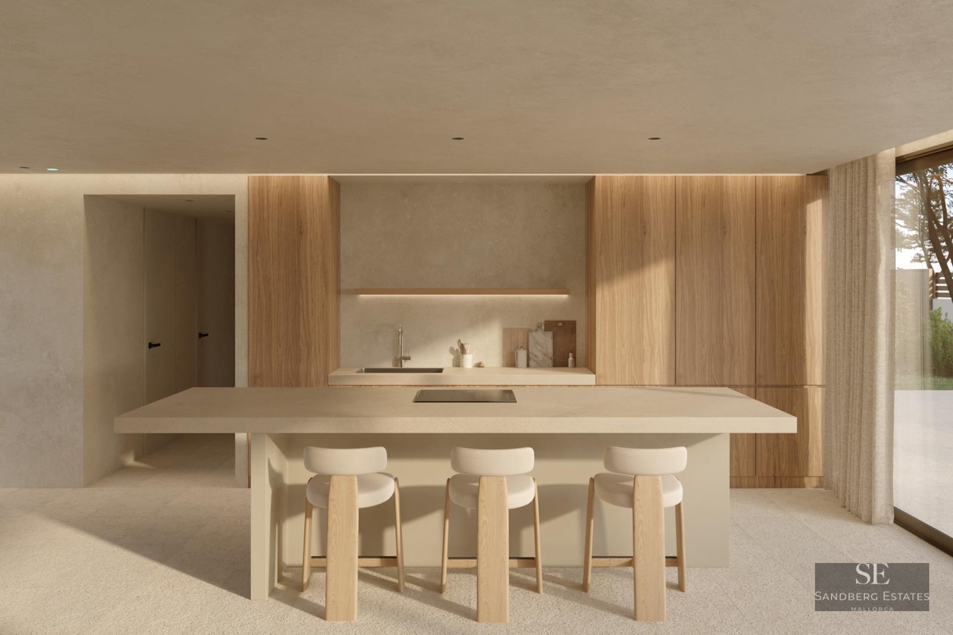 Modern minimalist kitchen featuring a large beige island, light wood cabinetry, and three stylish bar stools in a bright space.