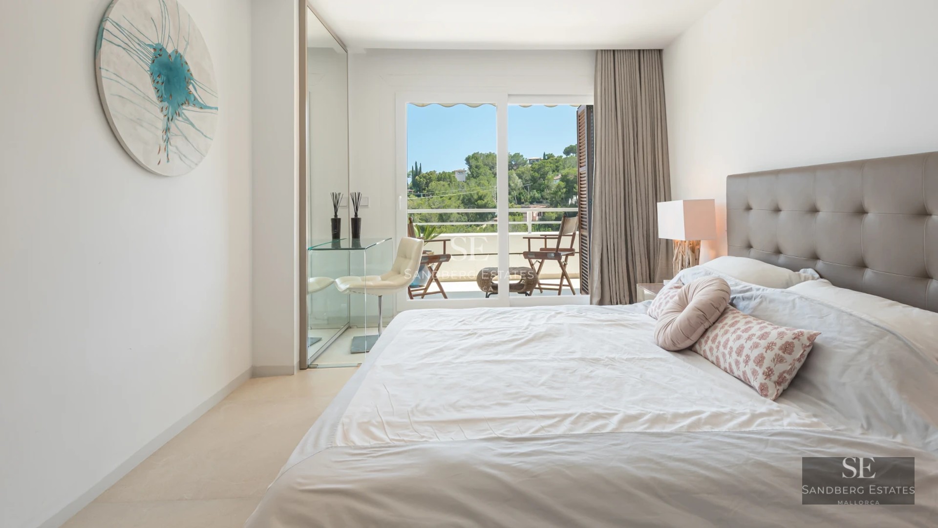 Spacious terrace with infinity pool and panoramic views. Modern design with sun loungers and parasols. Ideal for relaxation and enjoyment.