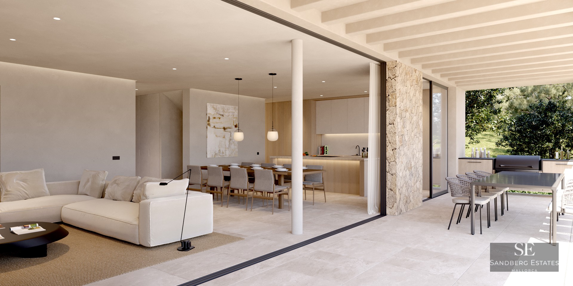 Spacious indoor living room with white sofa flowing into an outdoor terrace with dining and kitchen areas.