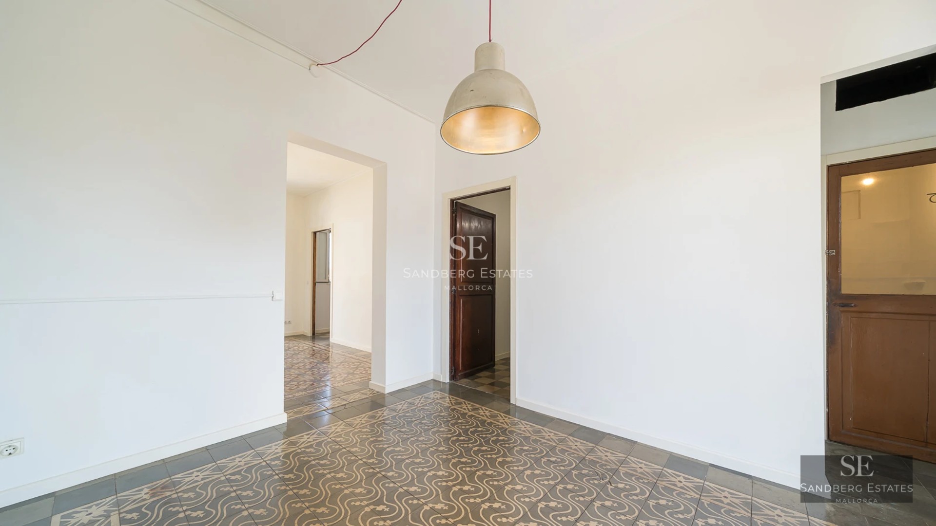 Exterior view of a modern villa featuring a pool, lush garden, and spacious terraces. Minimalist architecture with large windows.