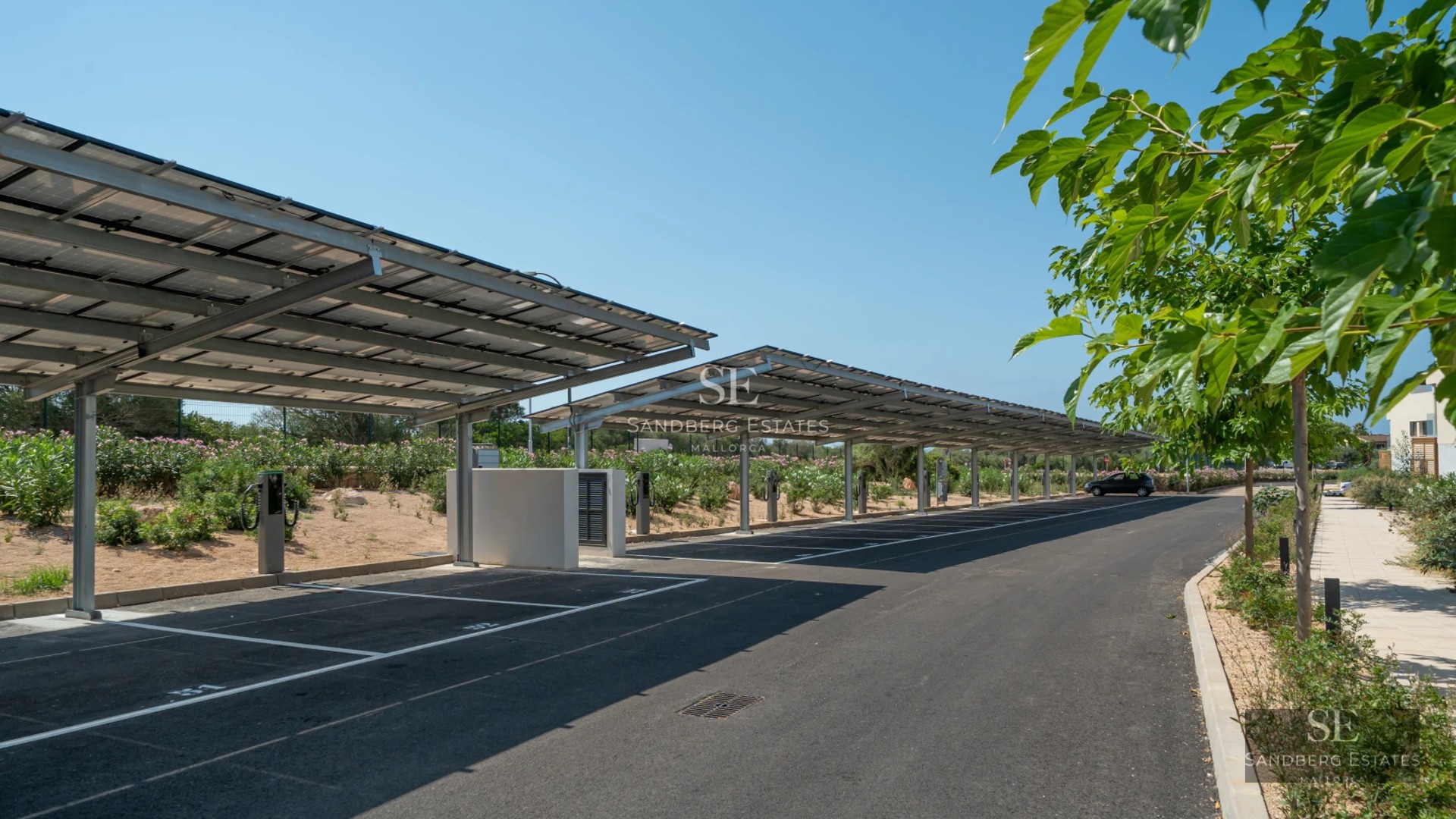 Expansive terrace with infinity pool, modern furniture, panoramic views, and lush greenery. Elegant and minimalist architectural design.