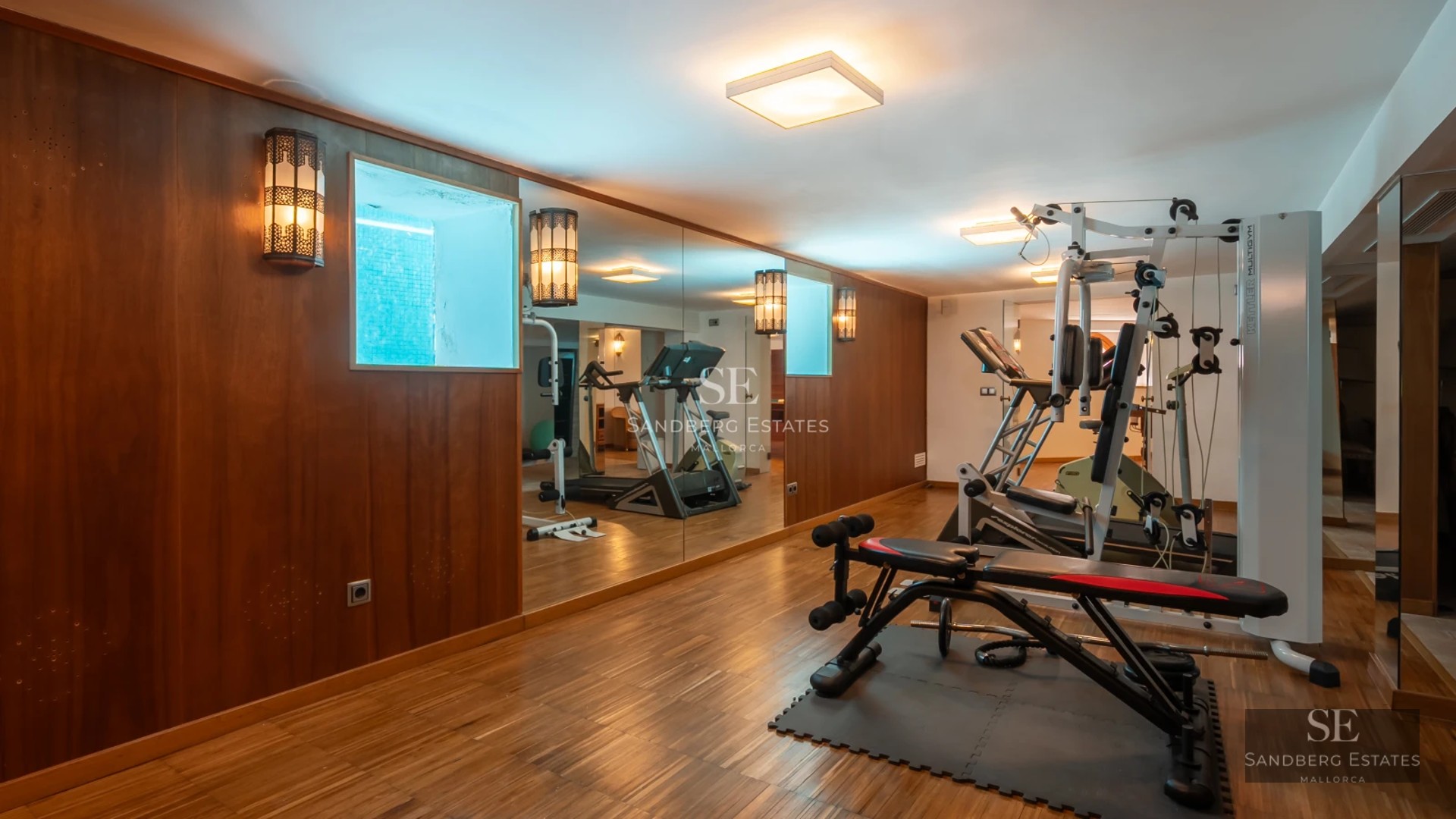 Exterior view of a luxurious house with a pool. Modern architecture, large windows, manicured landscaping, and clear blue sky.