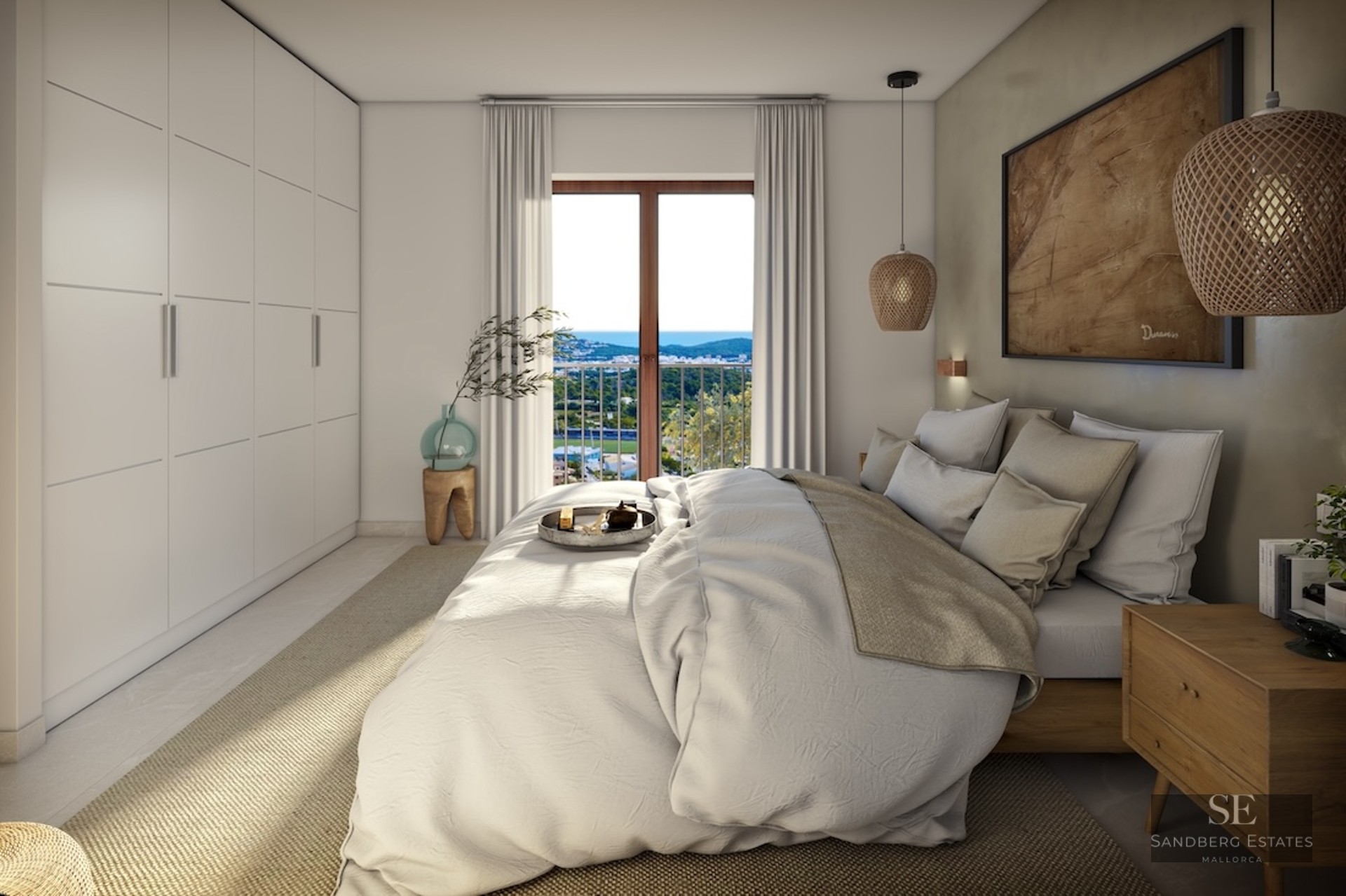 Bright master bedroom with a large bed, built-in white wardrobes, and a window overlooking a coastal landscape.