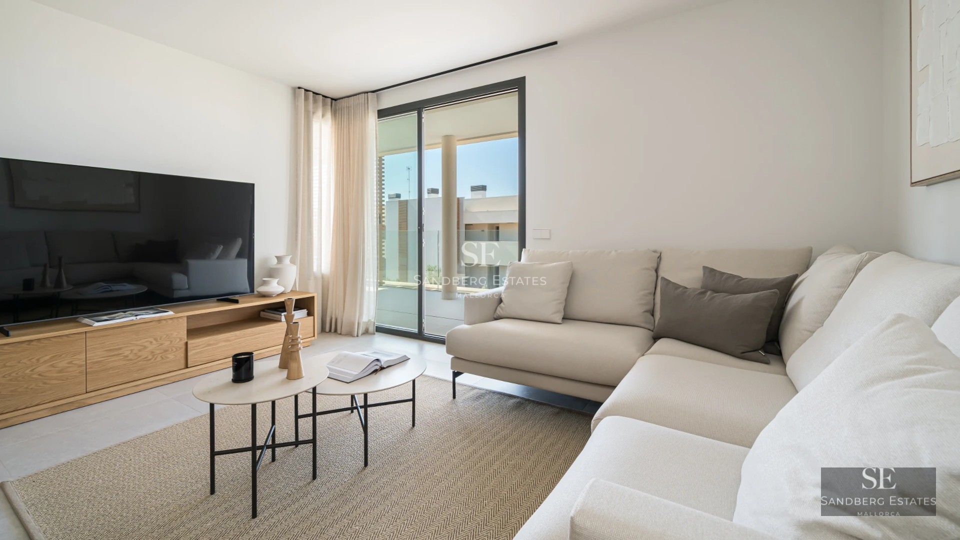 Exterior view of a luxury villa featuring a pool, lush vegetation, and modern architecture. Bright facade, large windows, and manicured landscaping.