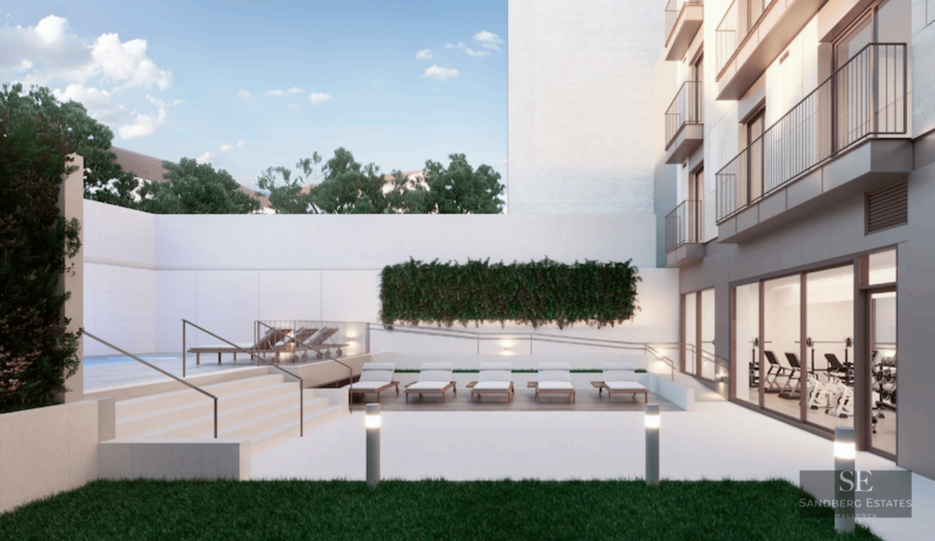 Modern outdoor terrace with sun loungers, a small pool, lawn area, and a view into a glass-walled indoor gym.